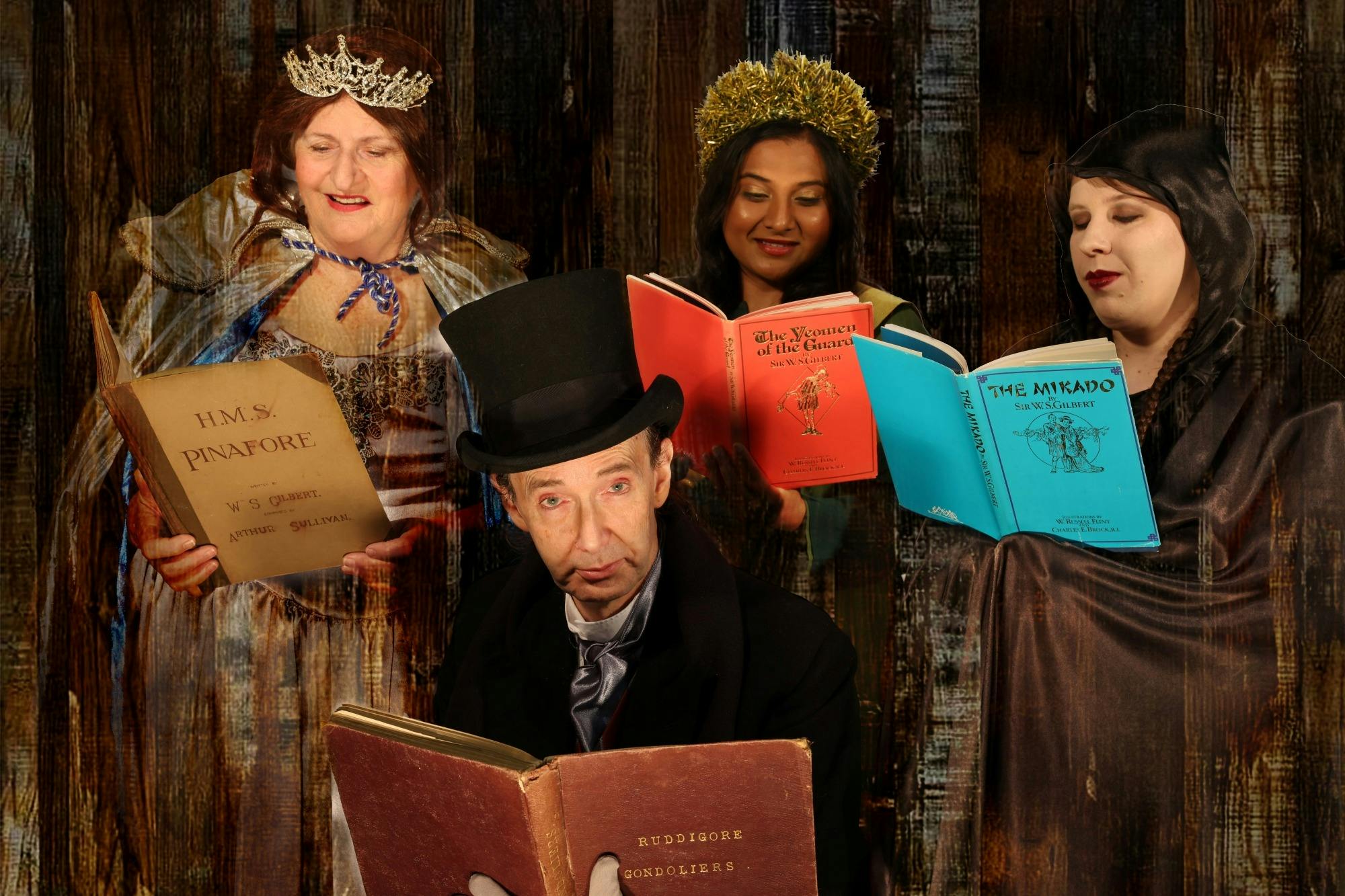 The ghosts of Christmas Past, Present and Future surround Scrooge as they read  G&S scores