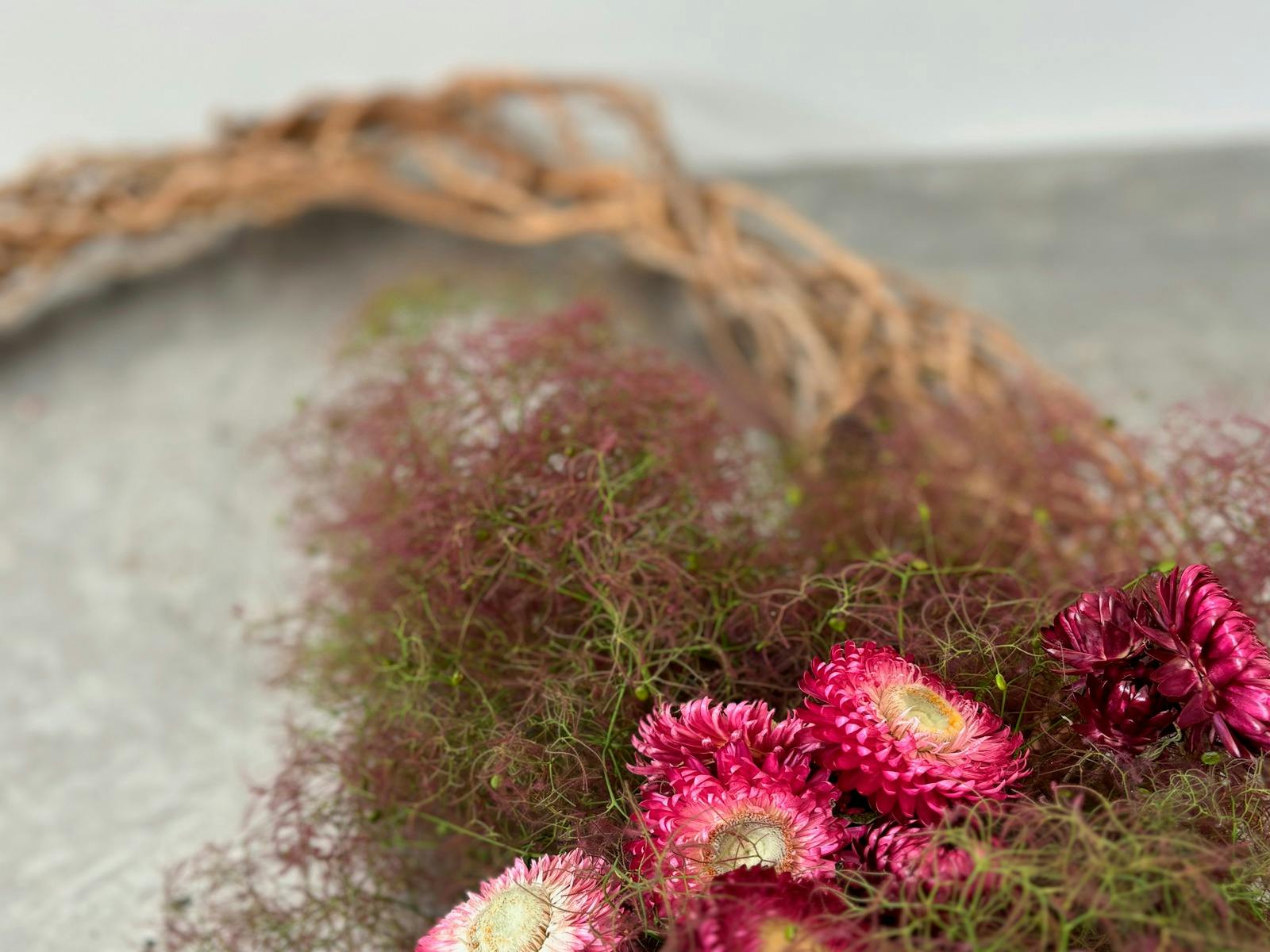 Close up of a fibre wall piece with flowers