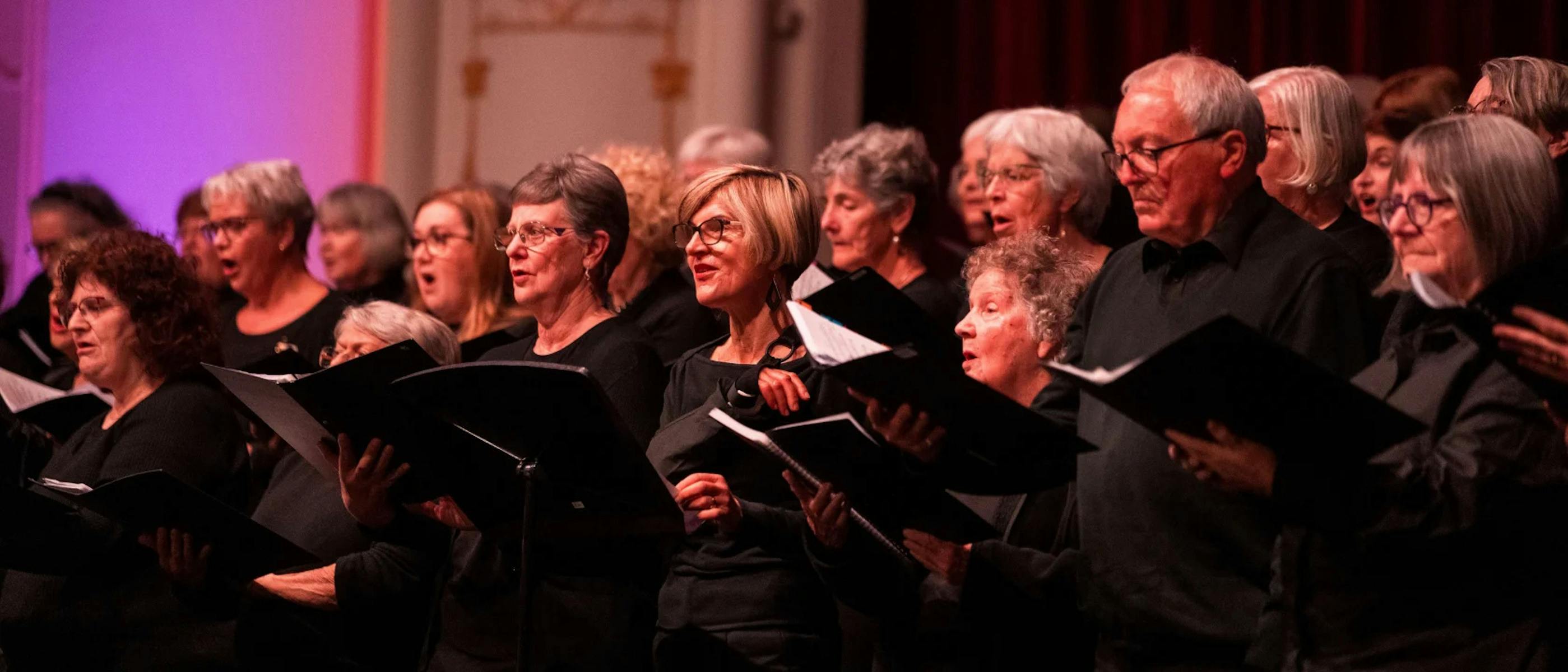 A group of singers dressed in black
