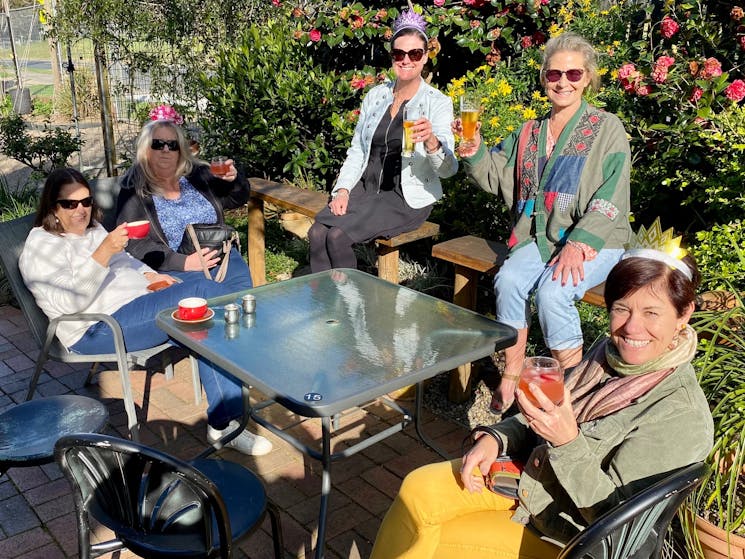 Guests Enjoy a beer in a garden setting