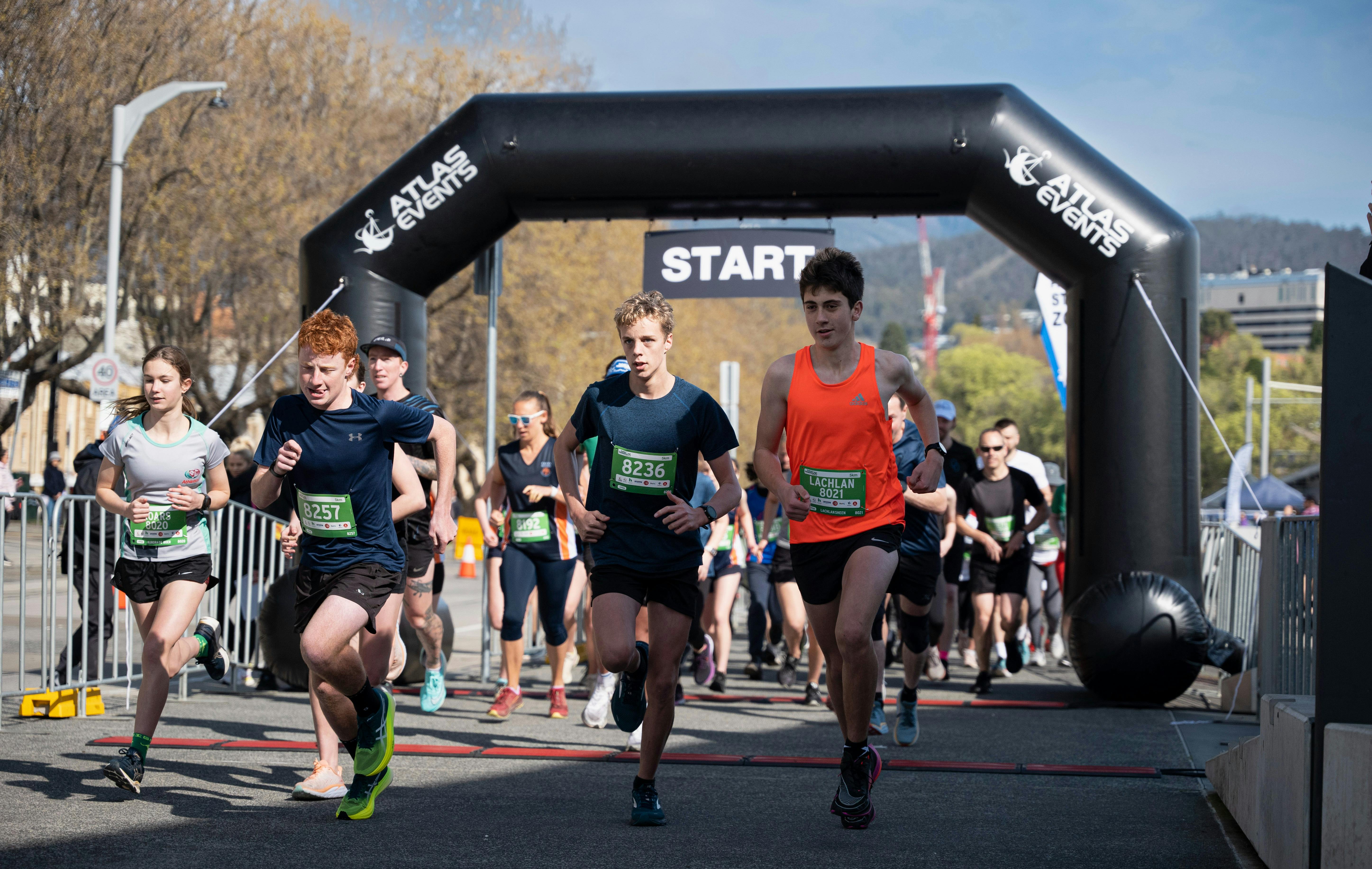 Runners crossing the start line