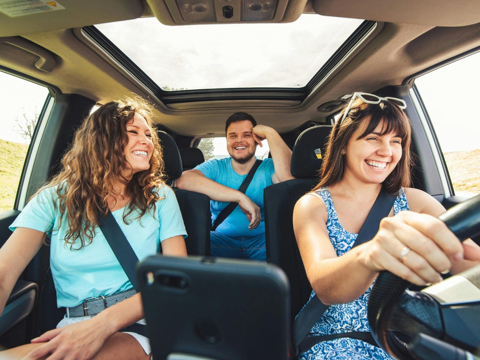 Group of Friends inside a car on a roadtrip
