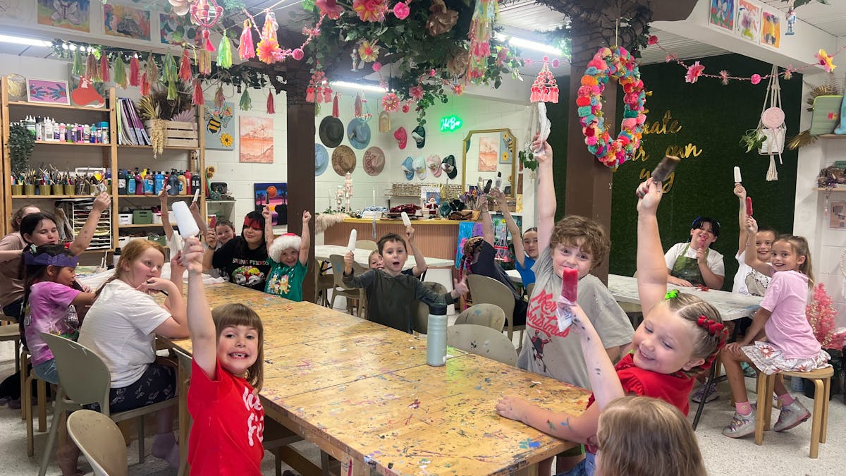 A group of children in the studio mid workshop