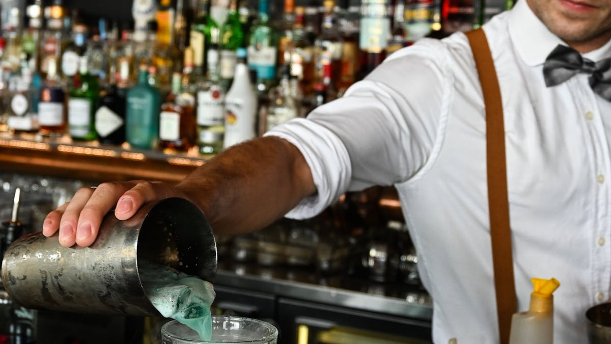 Bartender pouring a cocktail