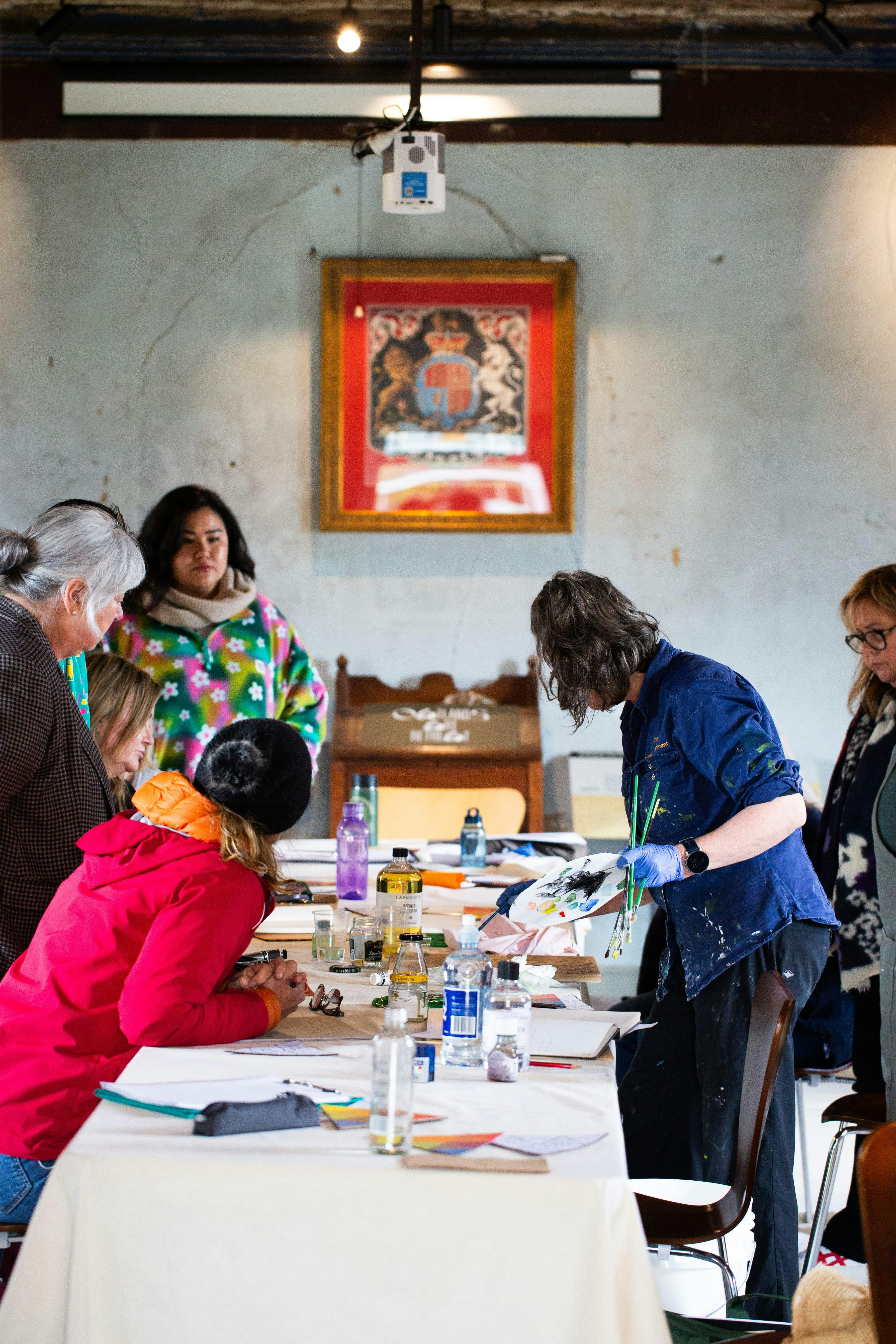 Artist Megan Walch demonstrating plein air painting techniques during the OAR 2025