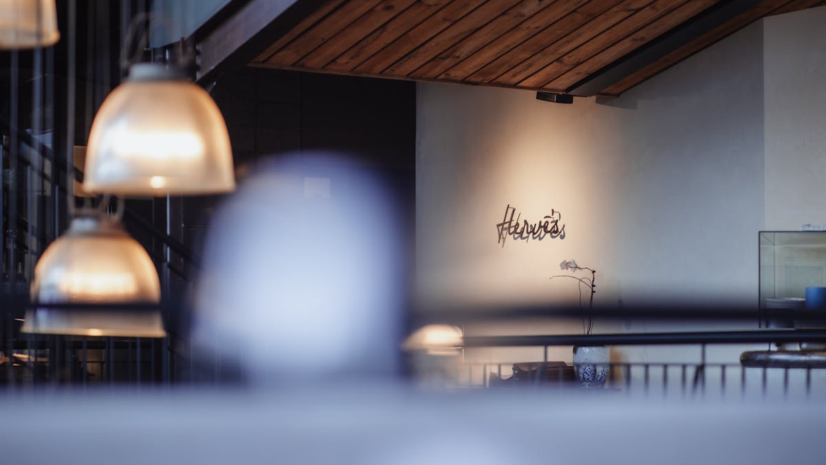 Moody lighting at entrance to Herve's