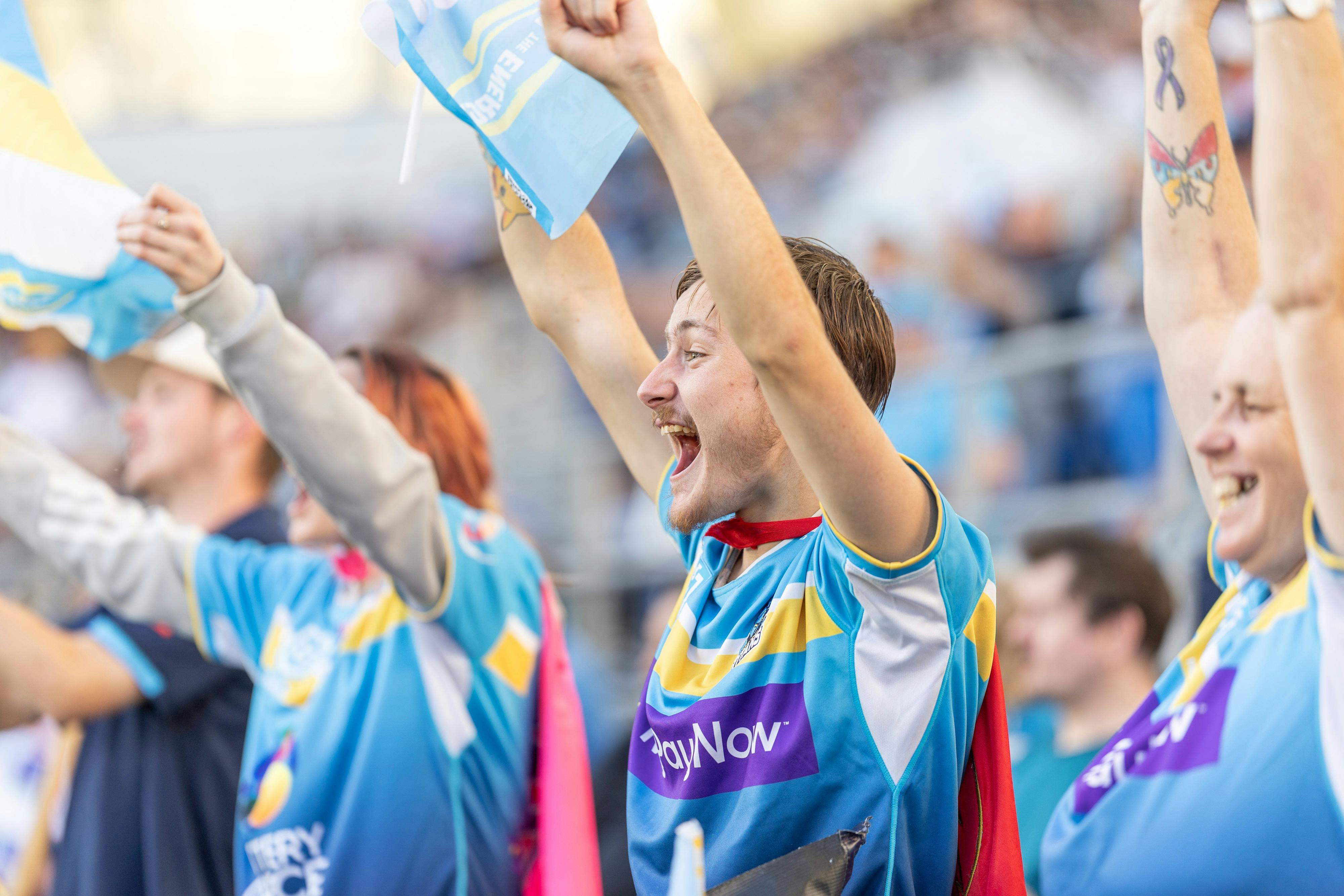 Gold Coast Titans fans cheering in the crowd