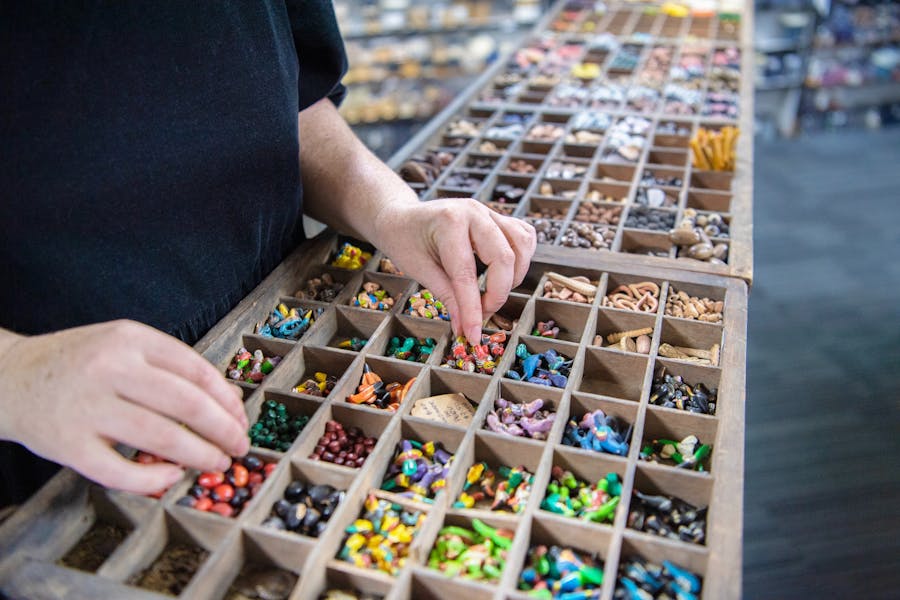 person looking at vintage beads on diusplay for sale at Bead Shack Gerringong NSW