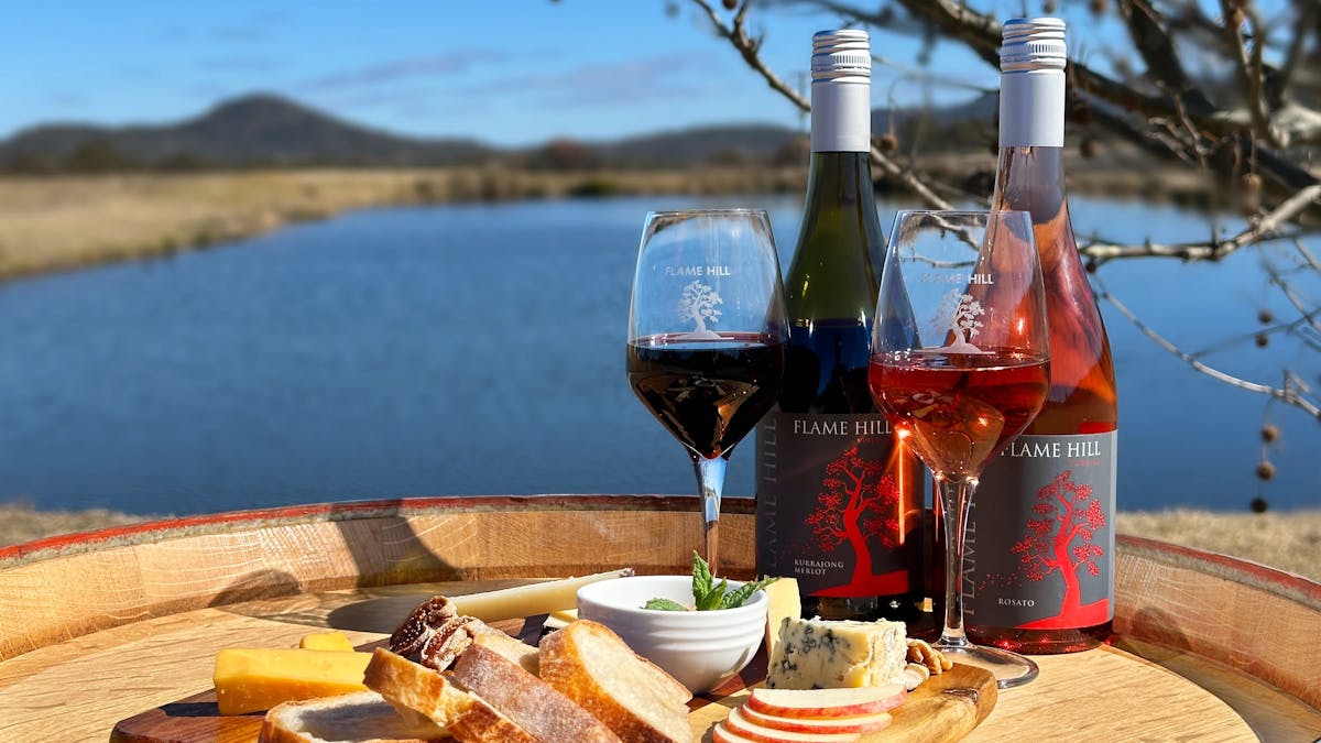 Cheese board and wine, Queensland  wine on barrel, glass of red granite belt, scenery granite  belt
