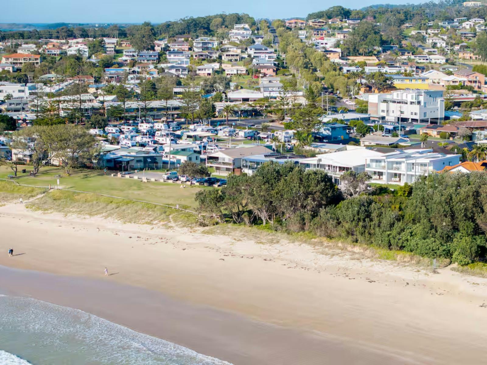 Woolgoolga Beach in foreground, Pure Adrift only steps from the beach