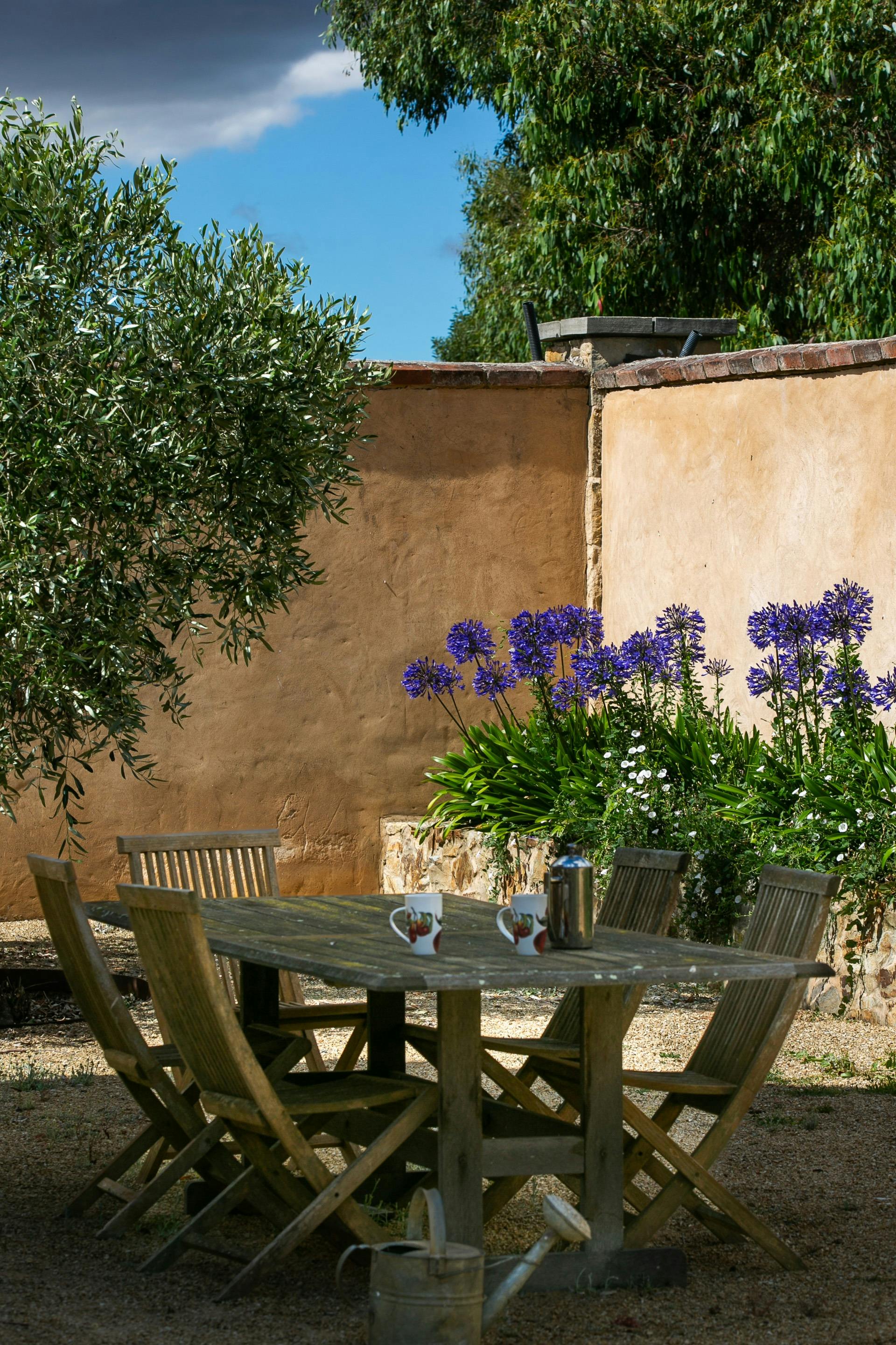 Walled courtyard for outdoor dining. Gas BBQ available