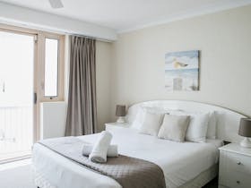 queen bed in a 1 Bedroom Ocean View Apartment