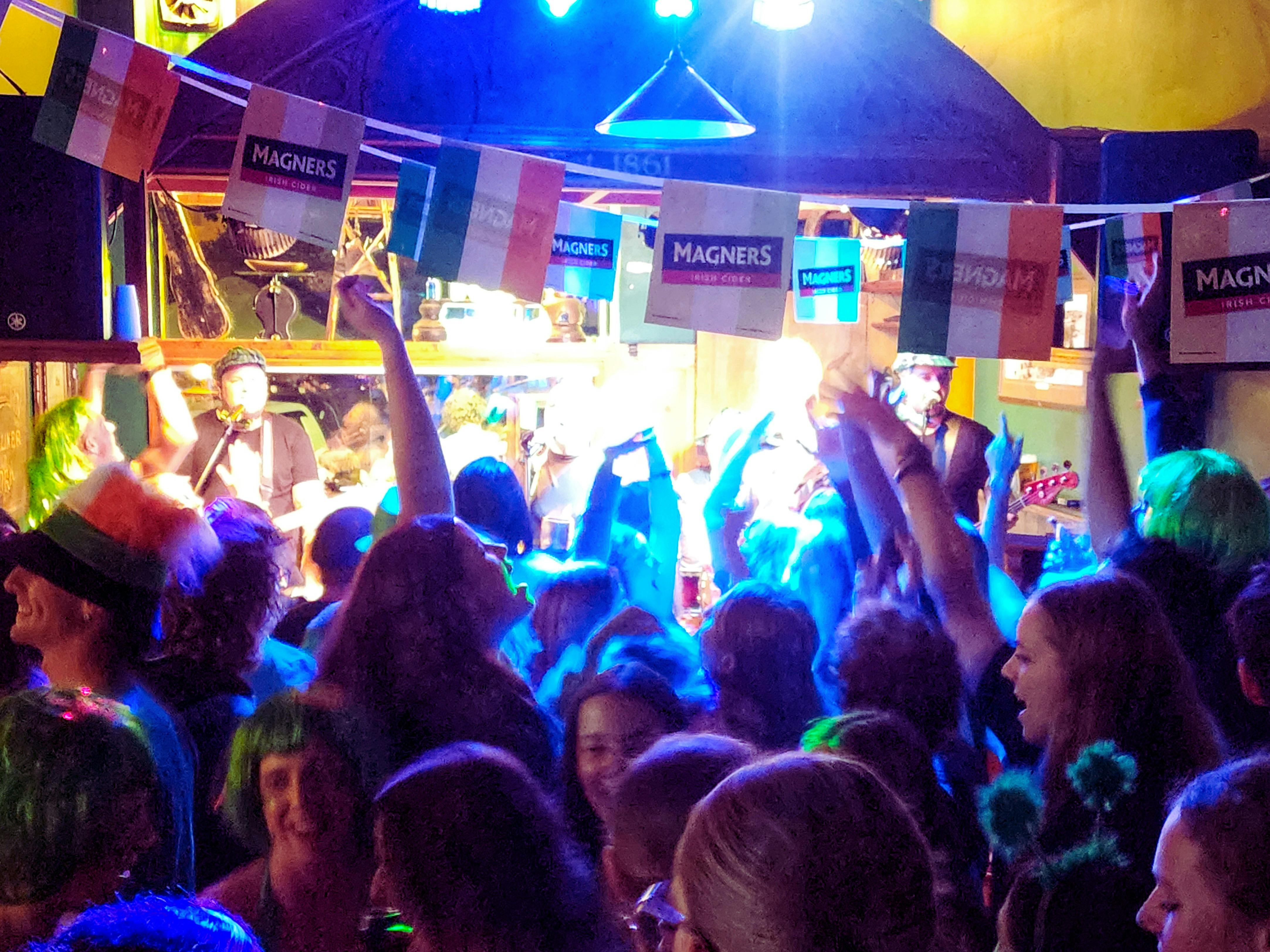 People are dancing on the dancefloor on St Patrick's Day