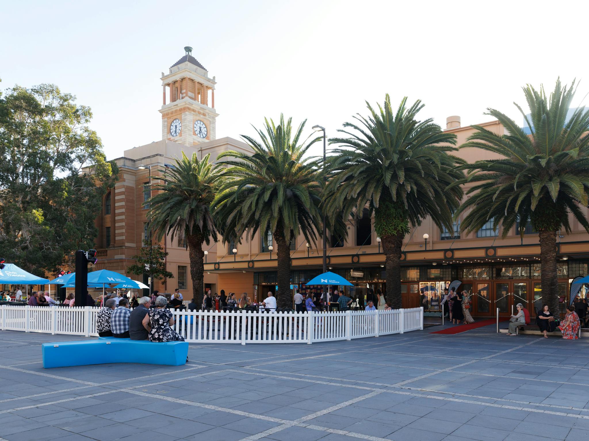 Photo of the Civic Theatre in daylight. A crowd of people stand in front of the theatre.