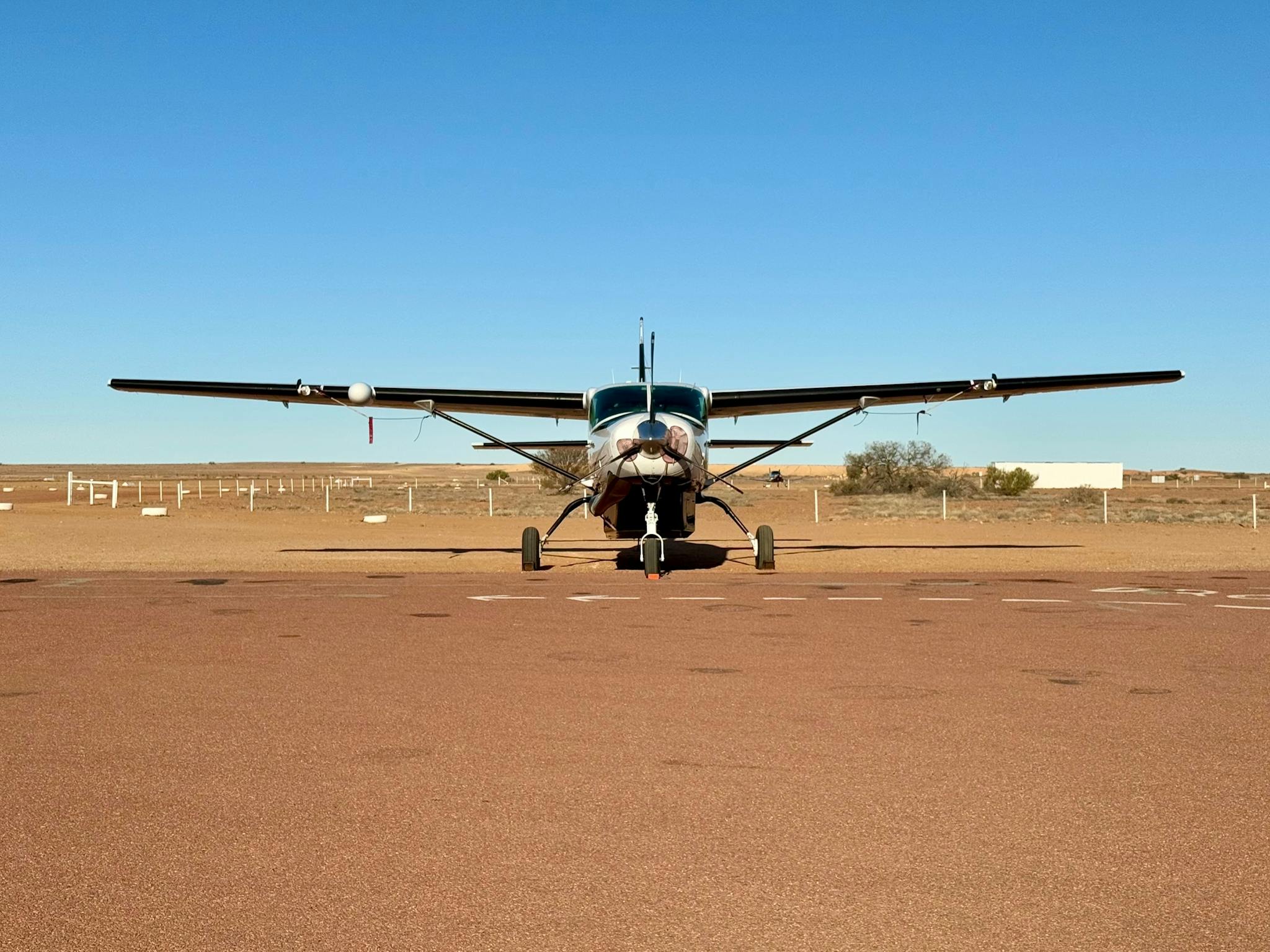 Charter aircraft on an outback runway in regional Australia Charter aircraft on an outback runway in regional Australia