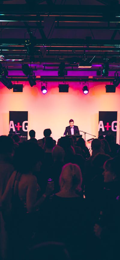 An event in the Main Hall at the Ainslie Arts Centre. Large crowd of people turned towards the stage