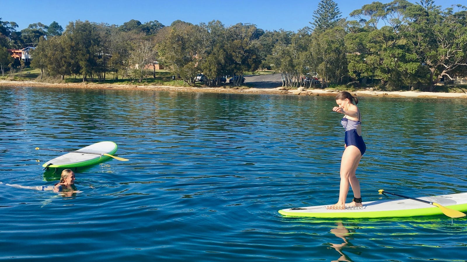 A reverse surf stance before the big splash, great paddle girls you deserve a dip to cool down.