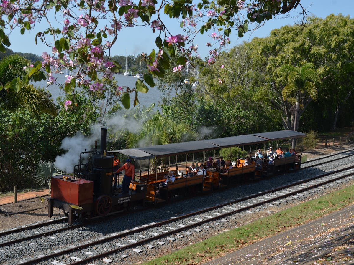 photo of Mary Anne Steam train in motion along the riverside track at Portside Maryborough.
