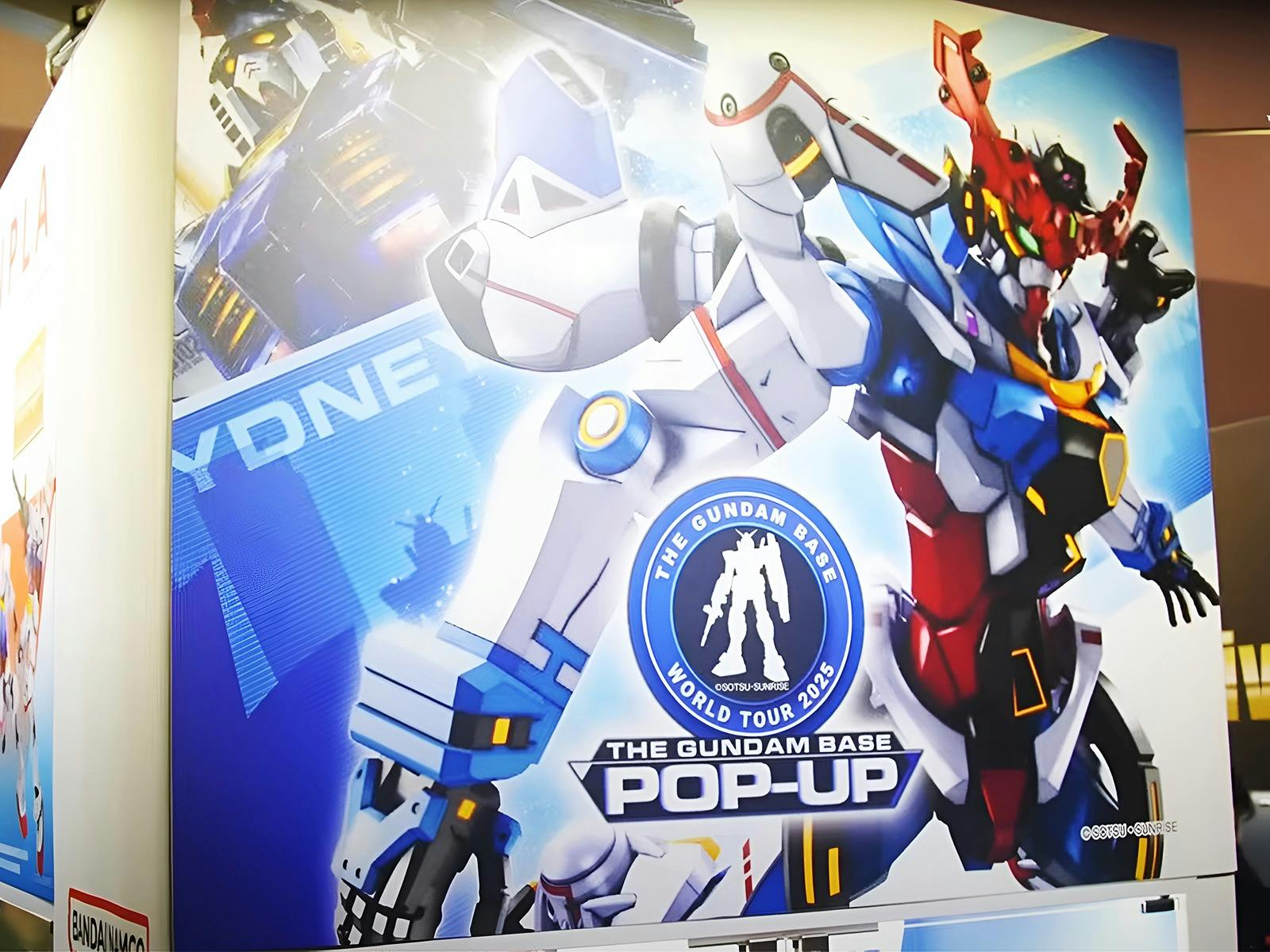Official poster for the Gundam Base Pop-Up World Tour Sydney 2025, featuring event dates, location,