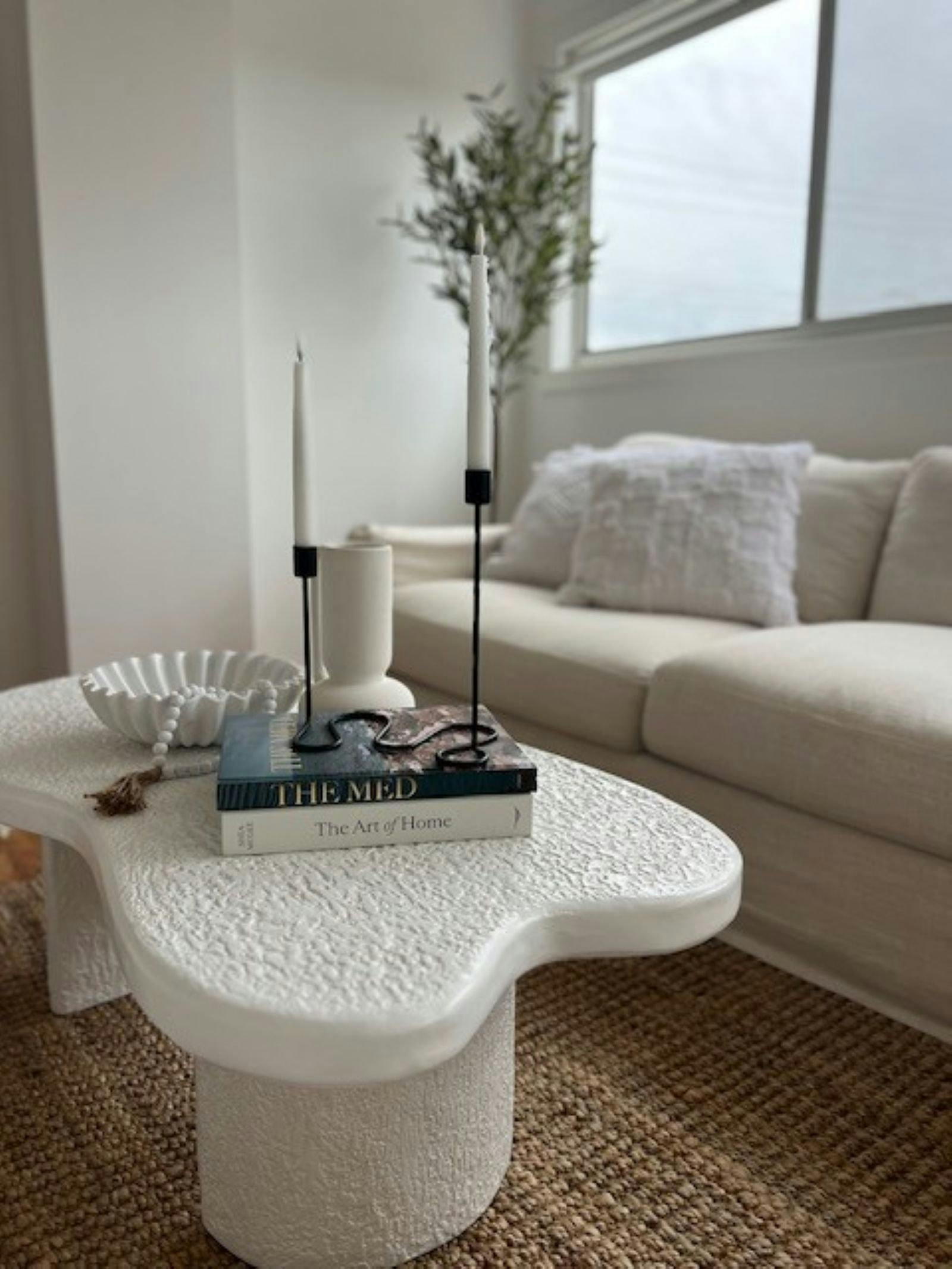 Candle lit coffee table and couch