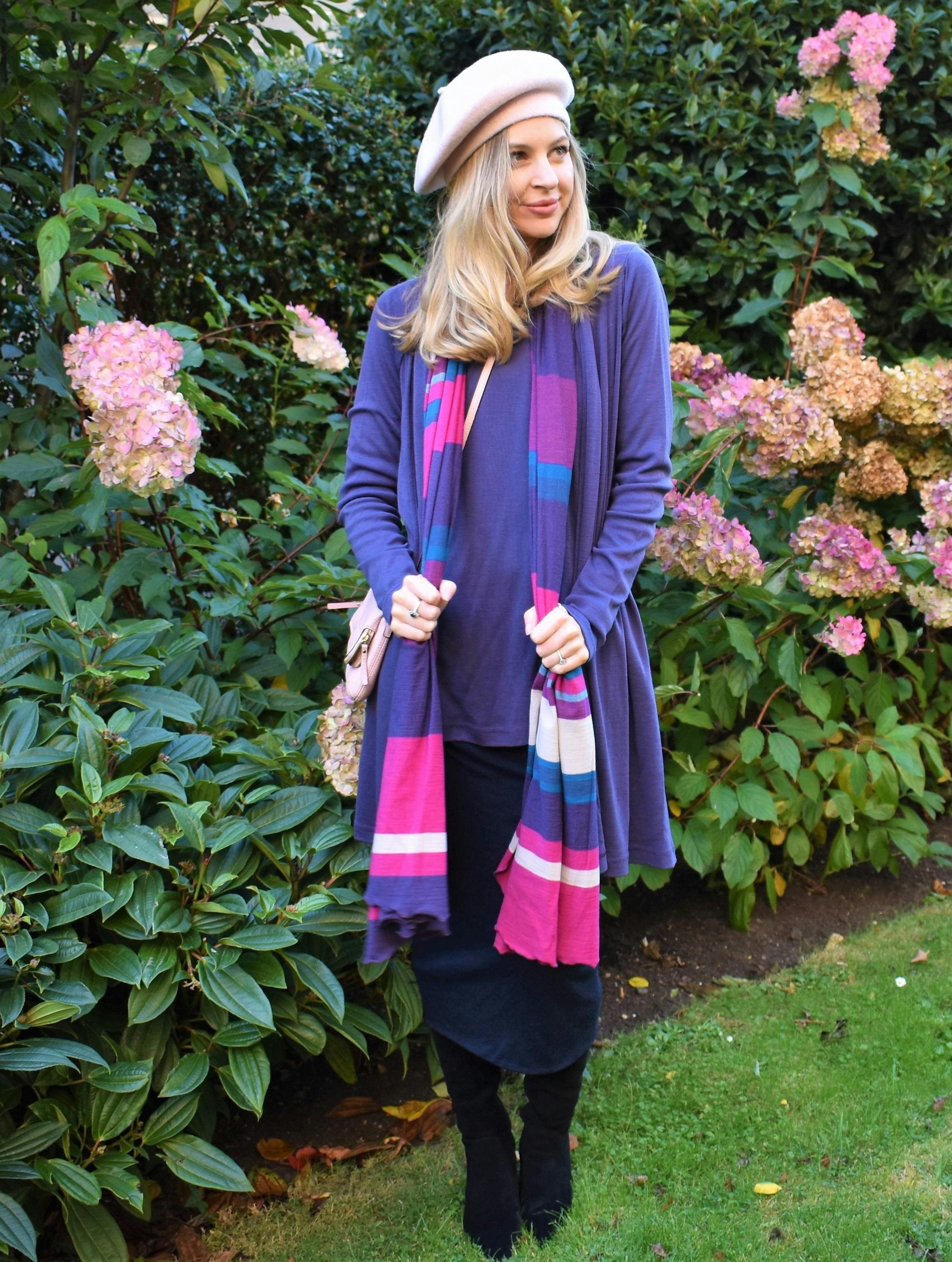 Woman in grape, pink, ivory multi stripe wool scarf