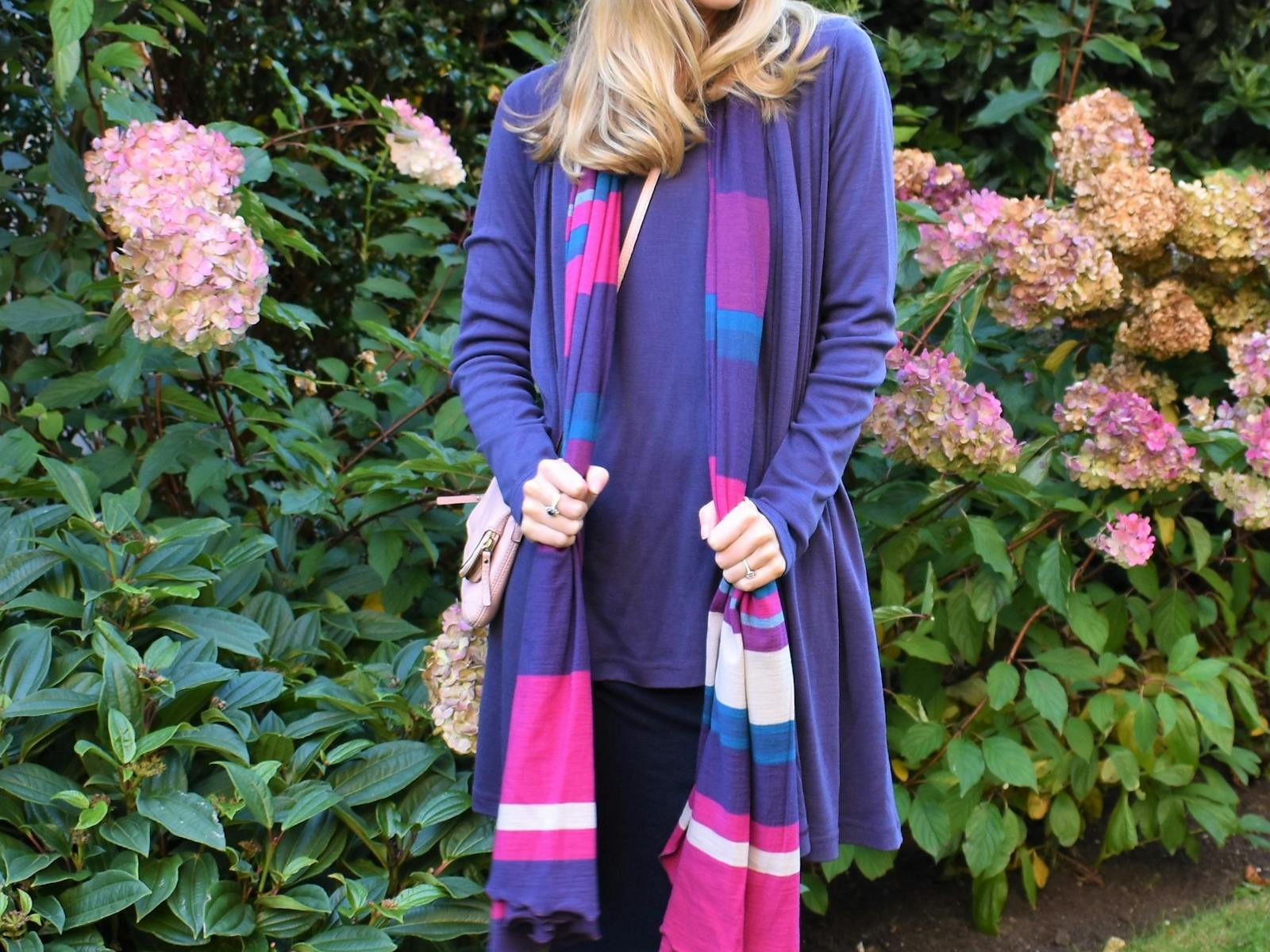 Woman in grape, pink, ivory multi stripe wool scarf
