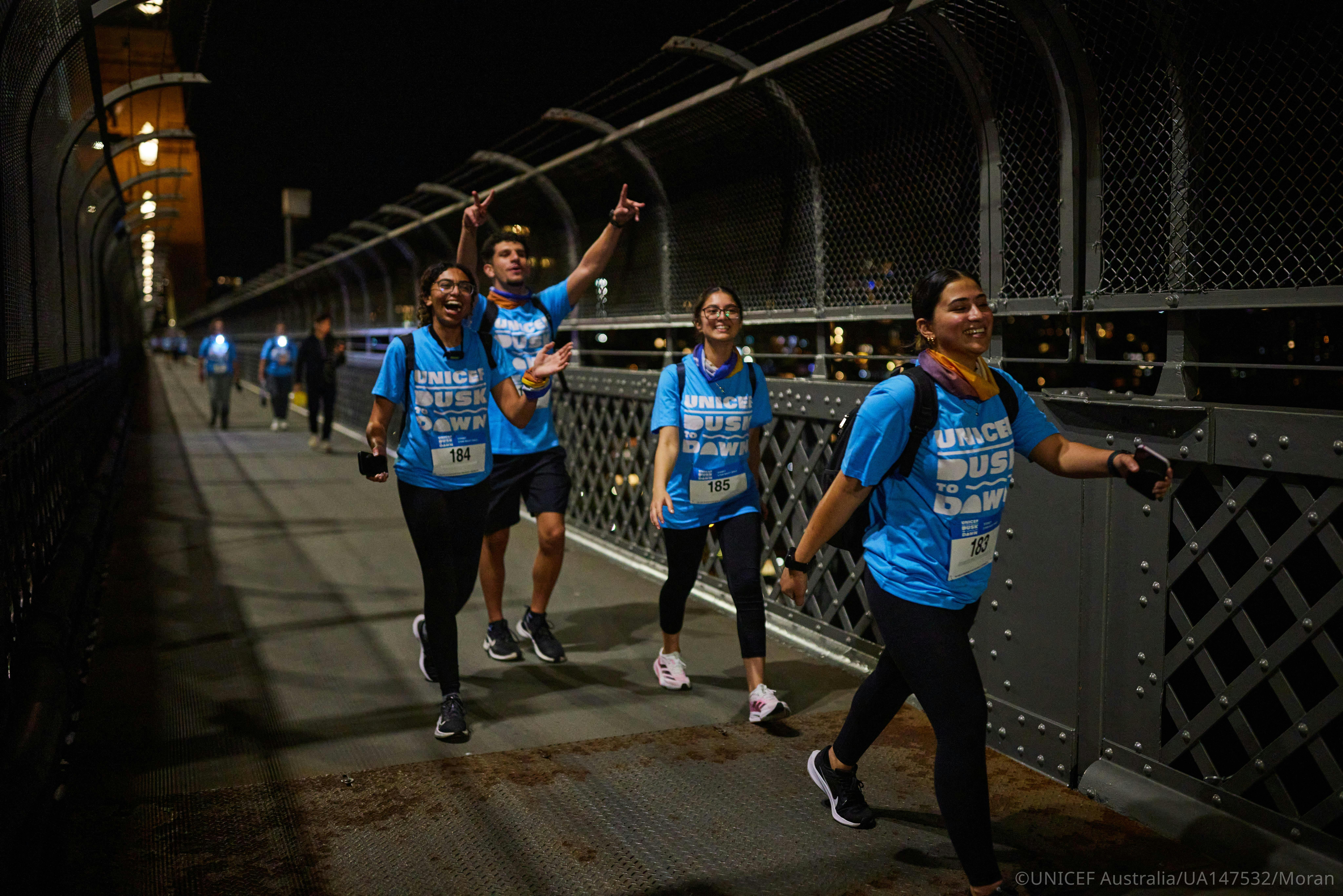 Dusk to Dawn participants walking together through Sydney at night.