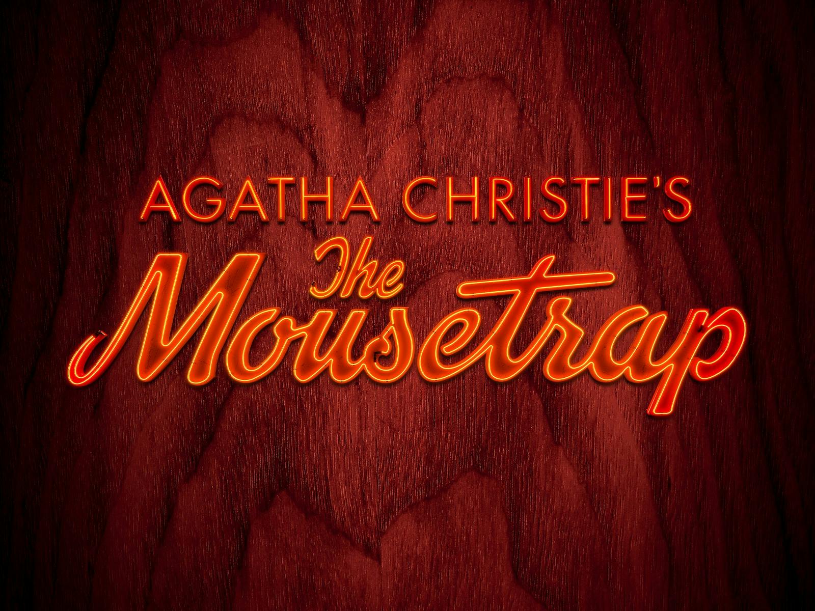 Agatha Cristie's The Mousetap in red neon on a woodgrain background.