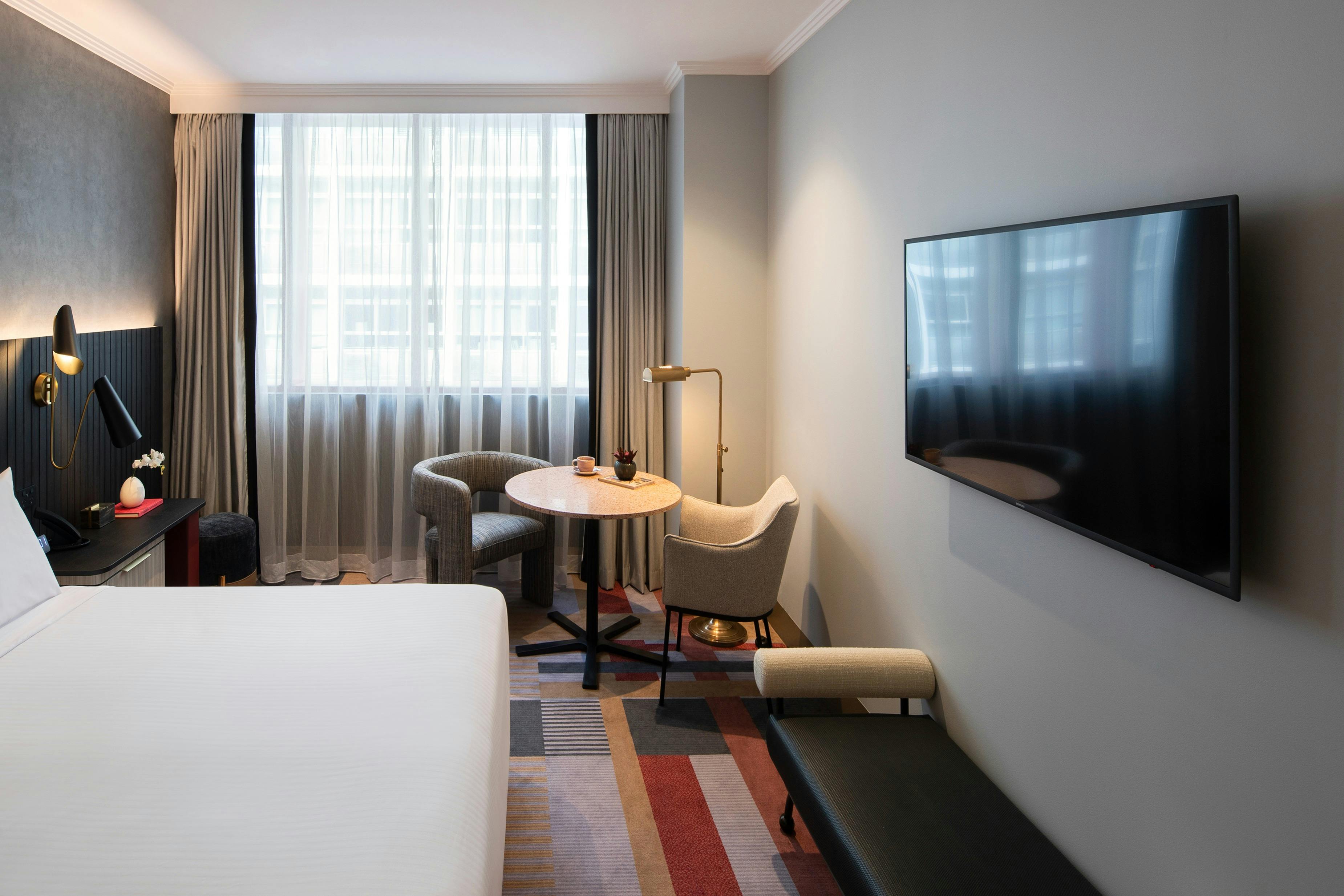 Photo with the lounge, TV and dining table with chairs