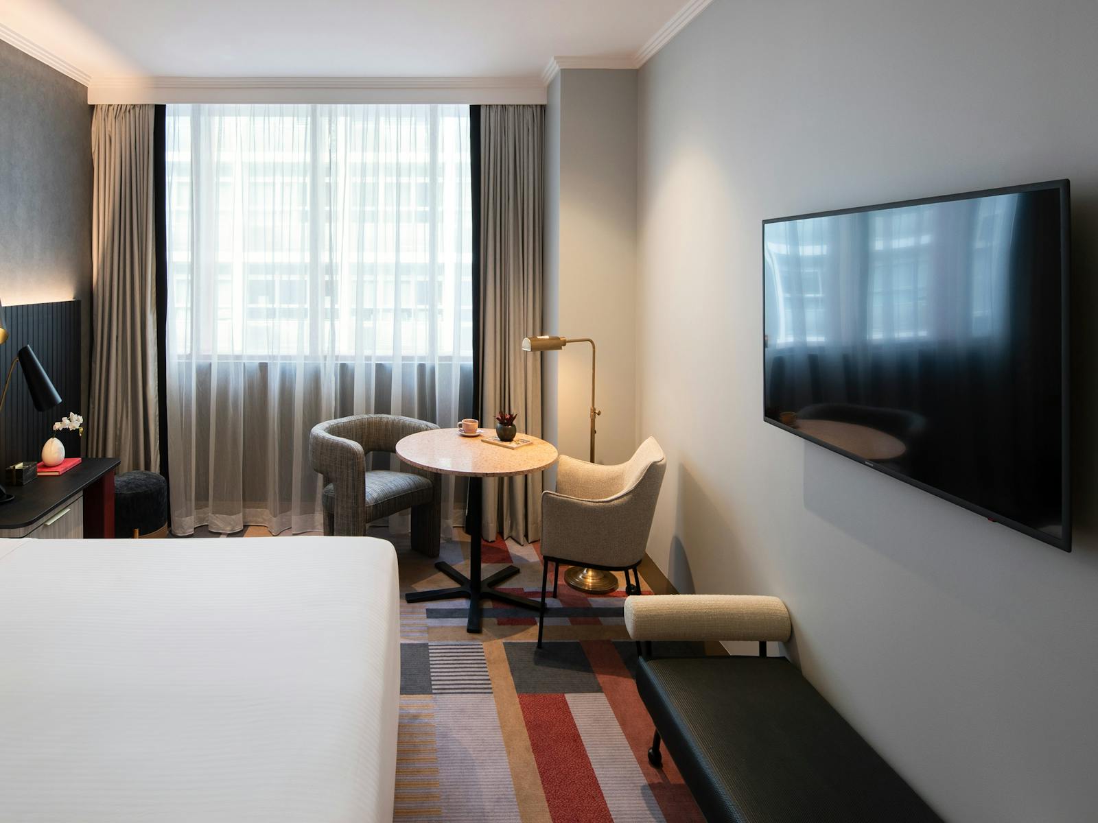 Photo with the lounge, TV and dining table with chairs