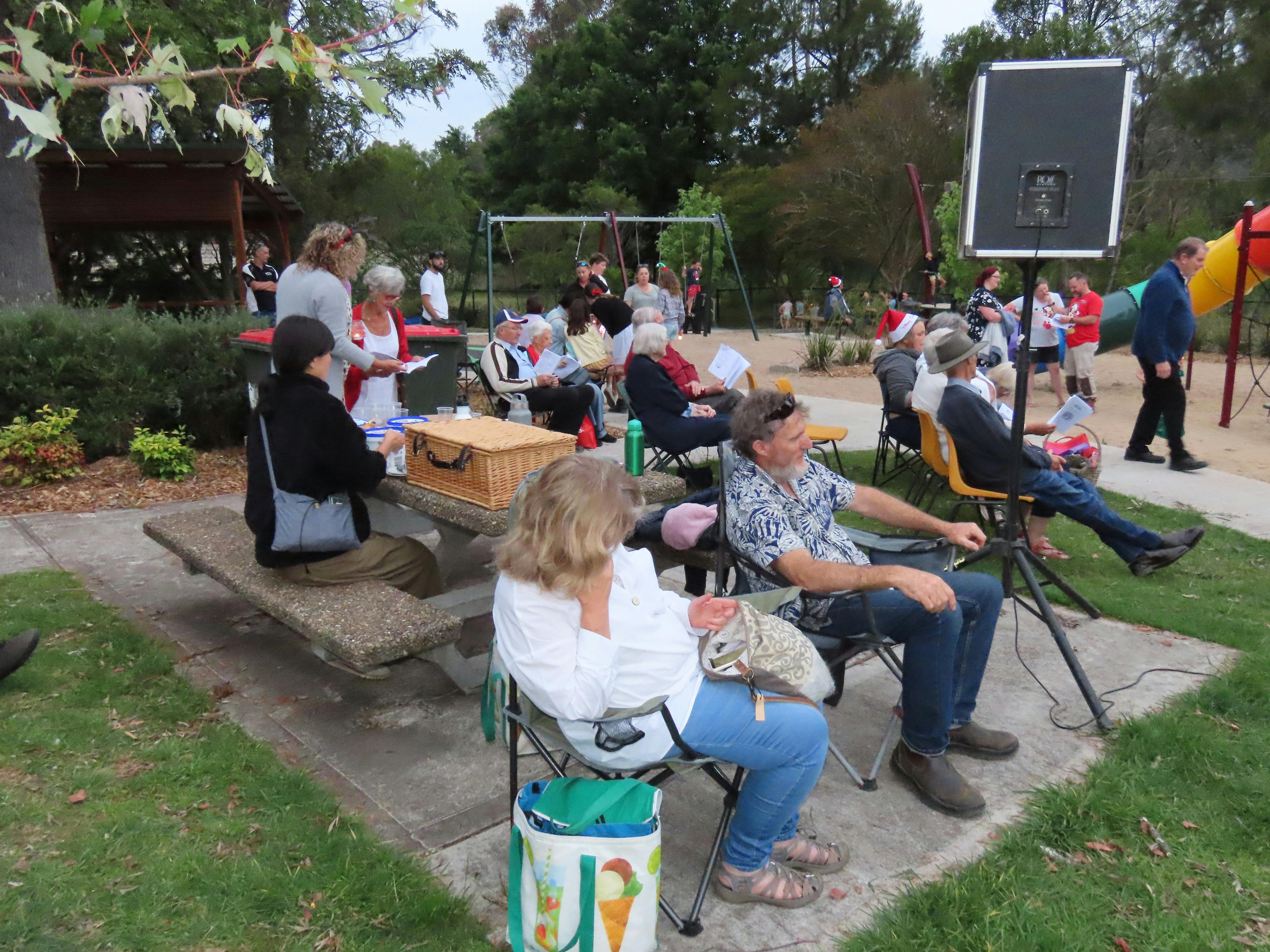 The community participating in carols by candlelight