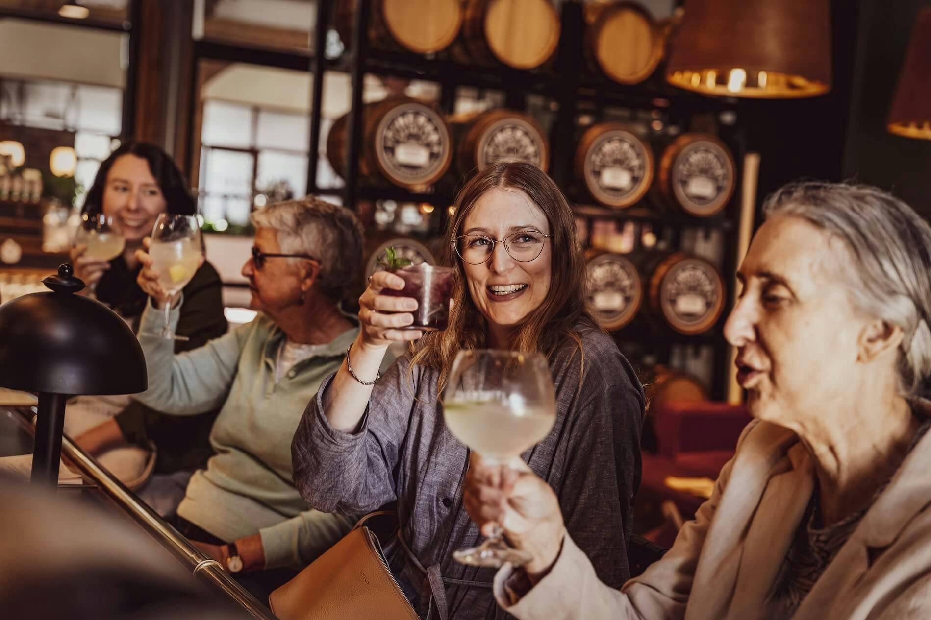 Four women enjoying drinks