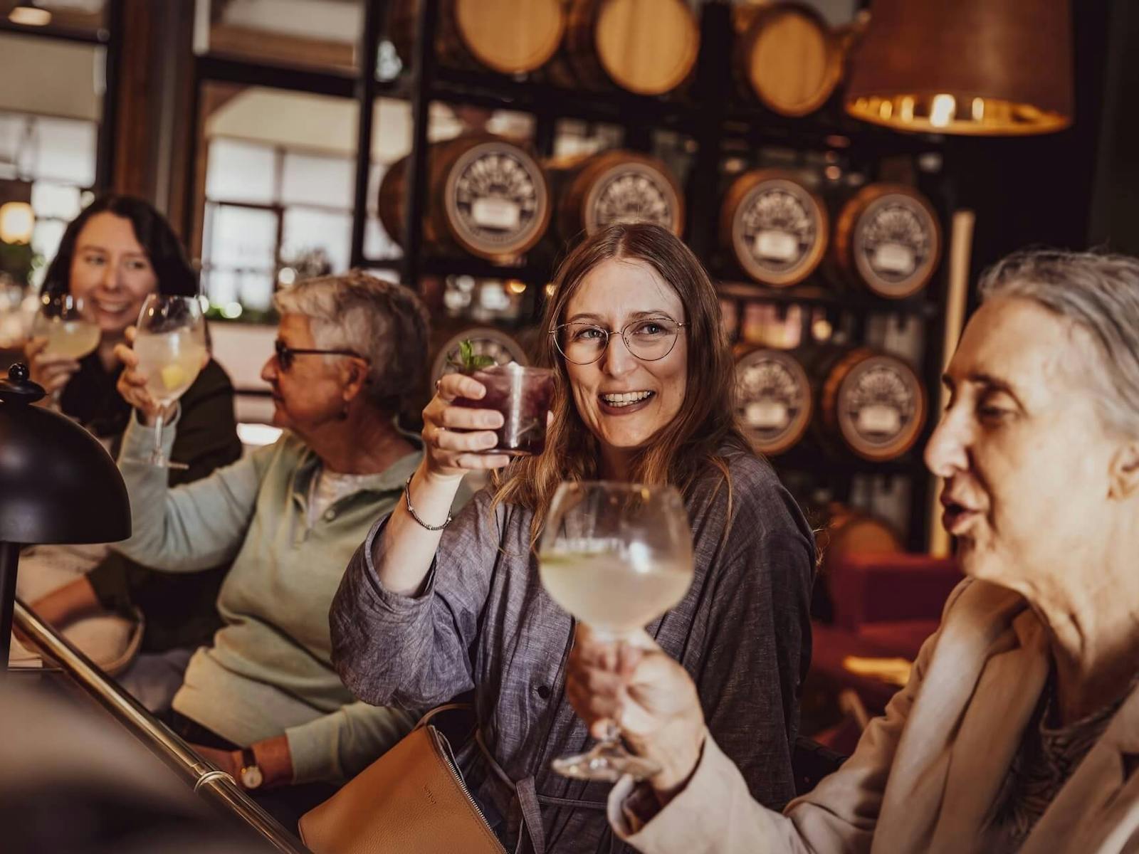 Four women enjoying drinks