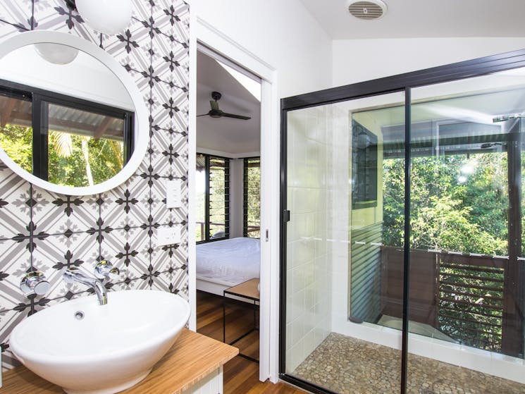 Luxury modern bathroom: Oversized shower, nature views, private spa retreat.