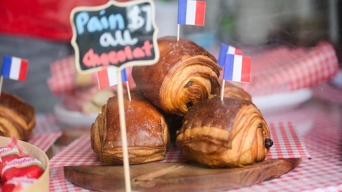 Pains au chocolate displayed with French flags