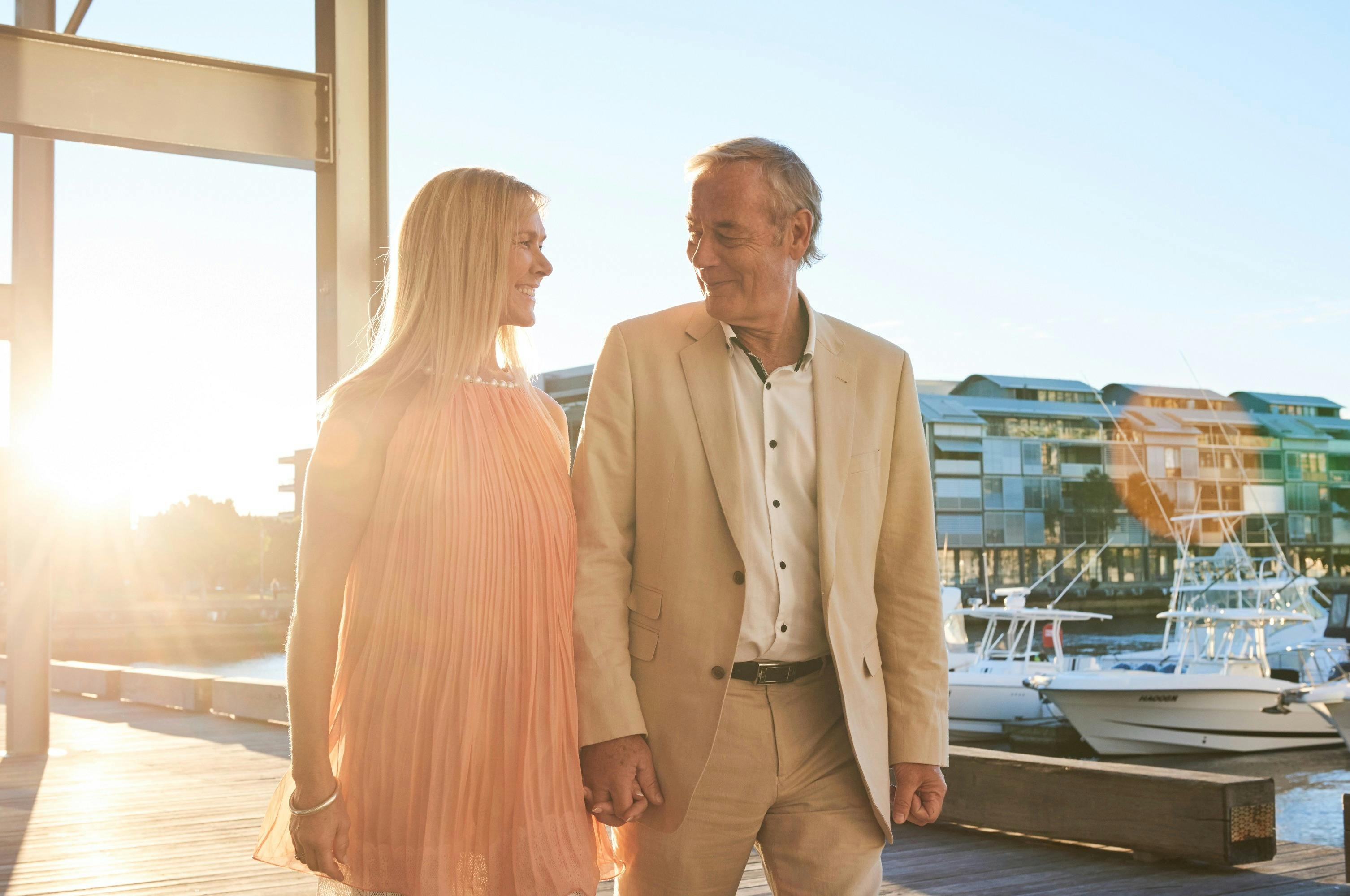 Couple walking by waterside restaurant LuMi Bar & Dining in Pyrmont