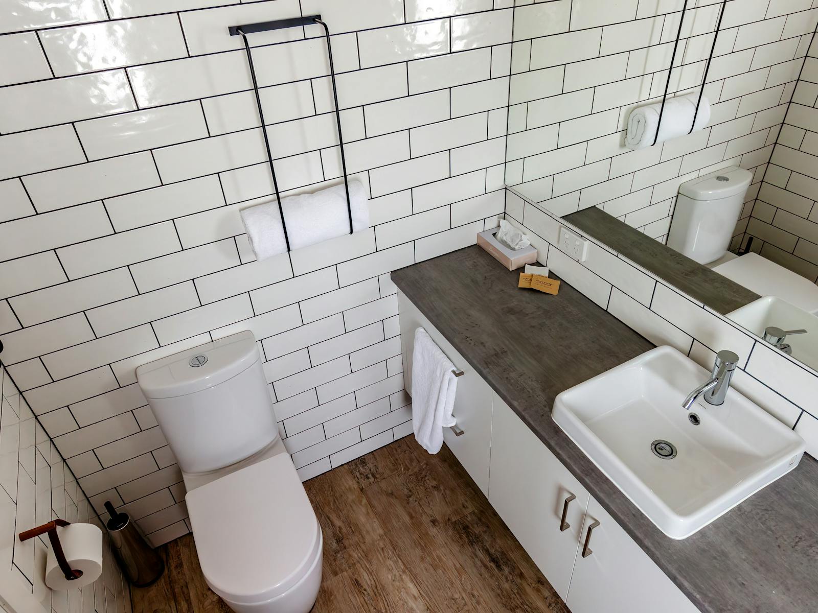 Ensuite bathroom showing  toilet  and sink area