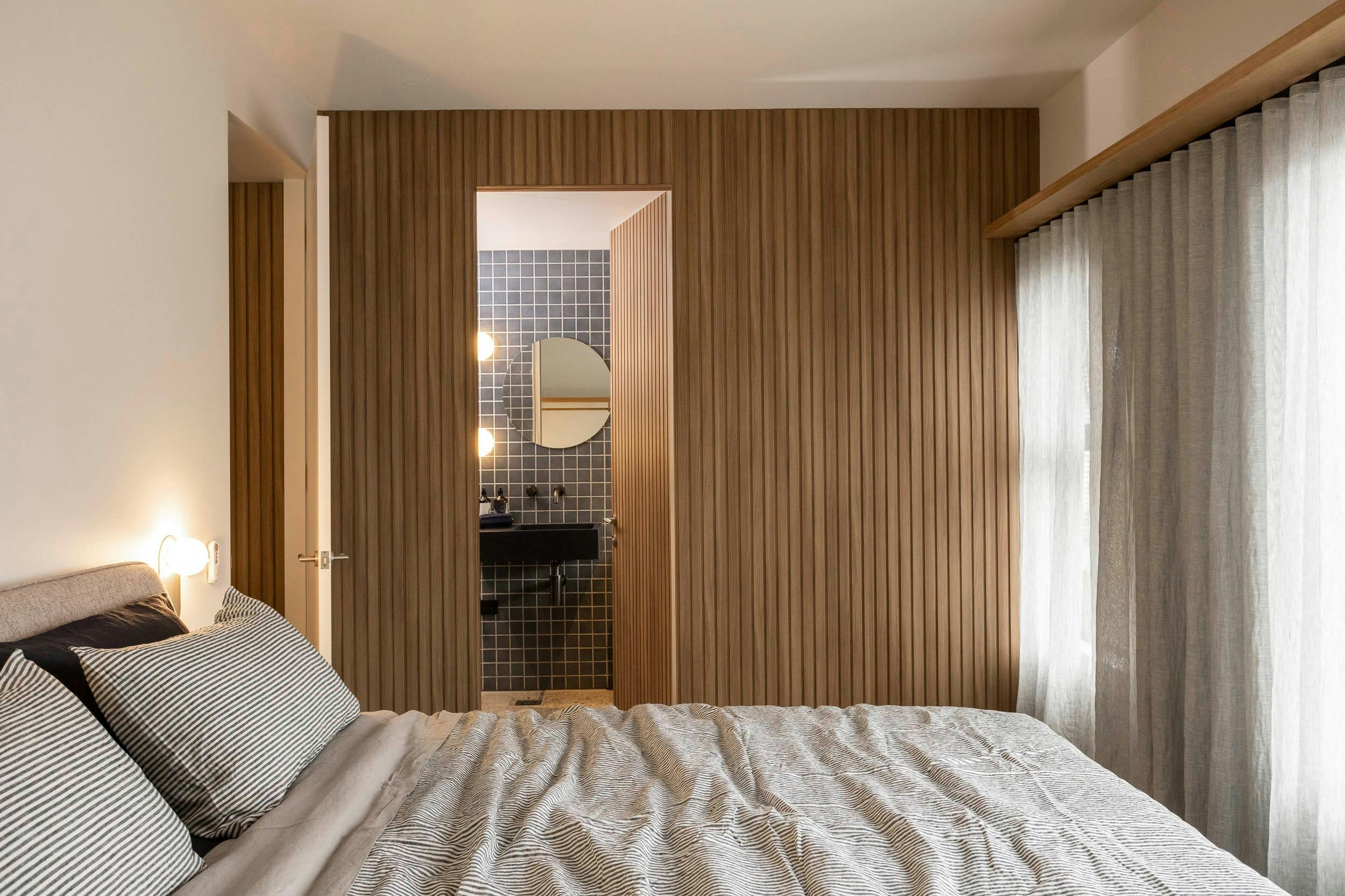 The master bedroom with glimpse of en suite in John's