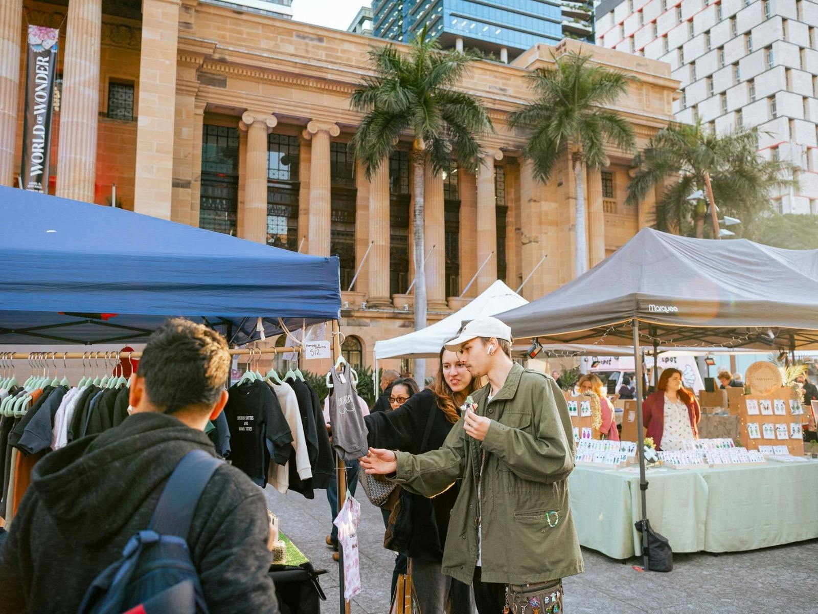 A Young Couple shopping at a market stall