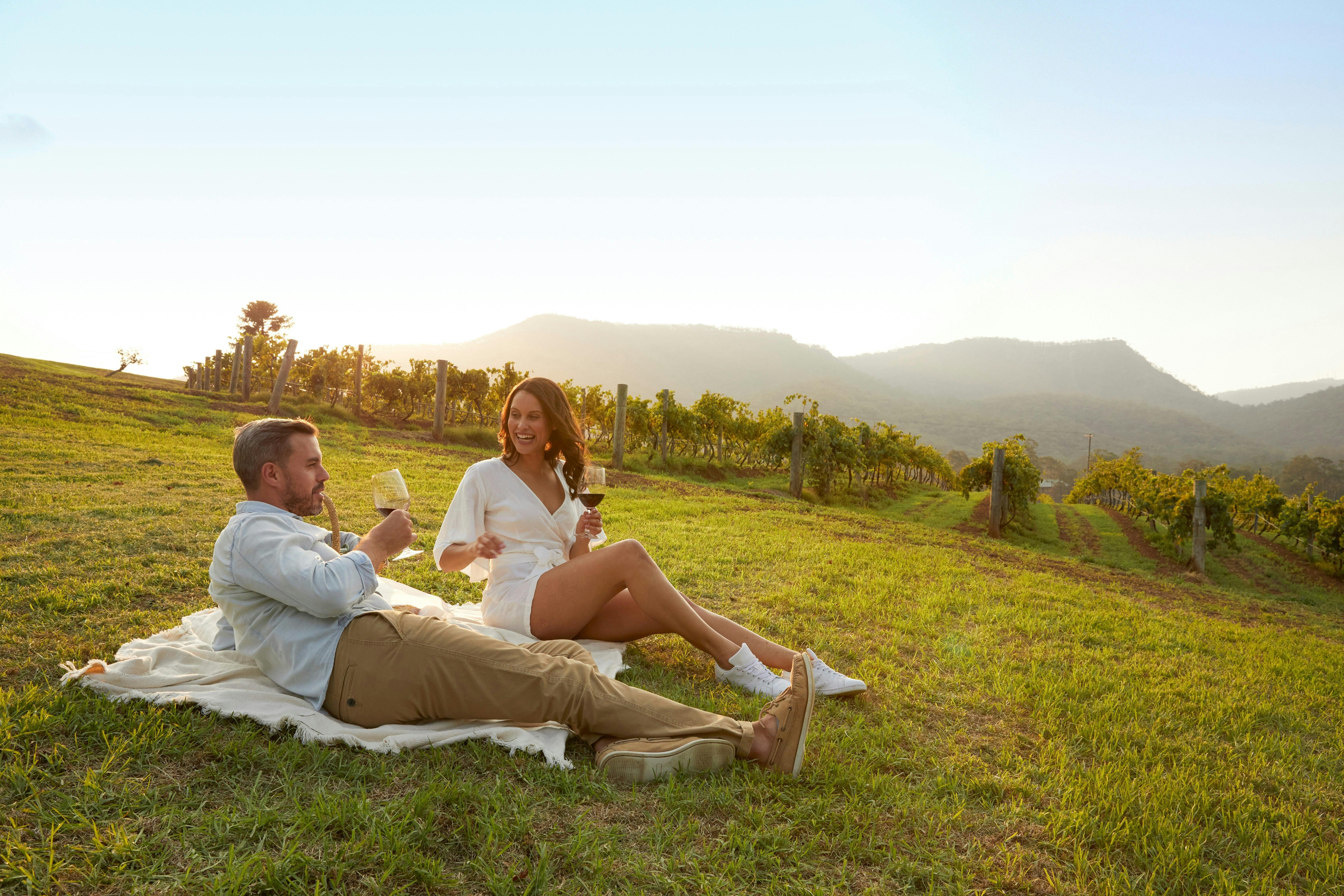 Autopia Tours - Hunter Valley - Couple enjoying a picnic, Pokolbin