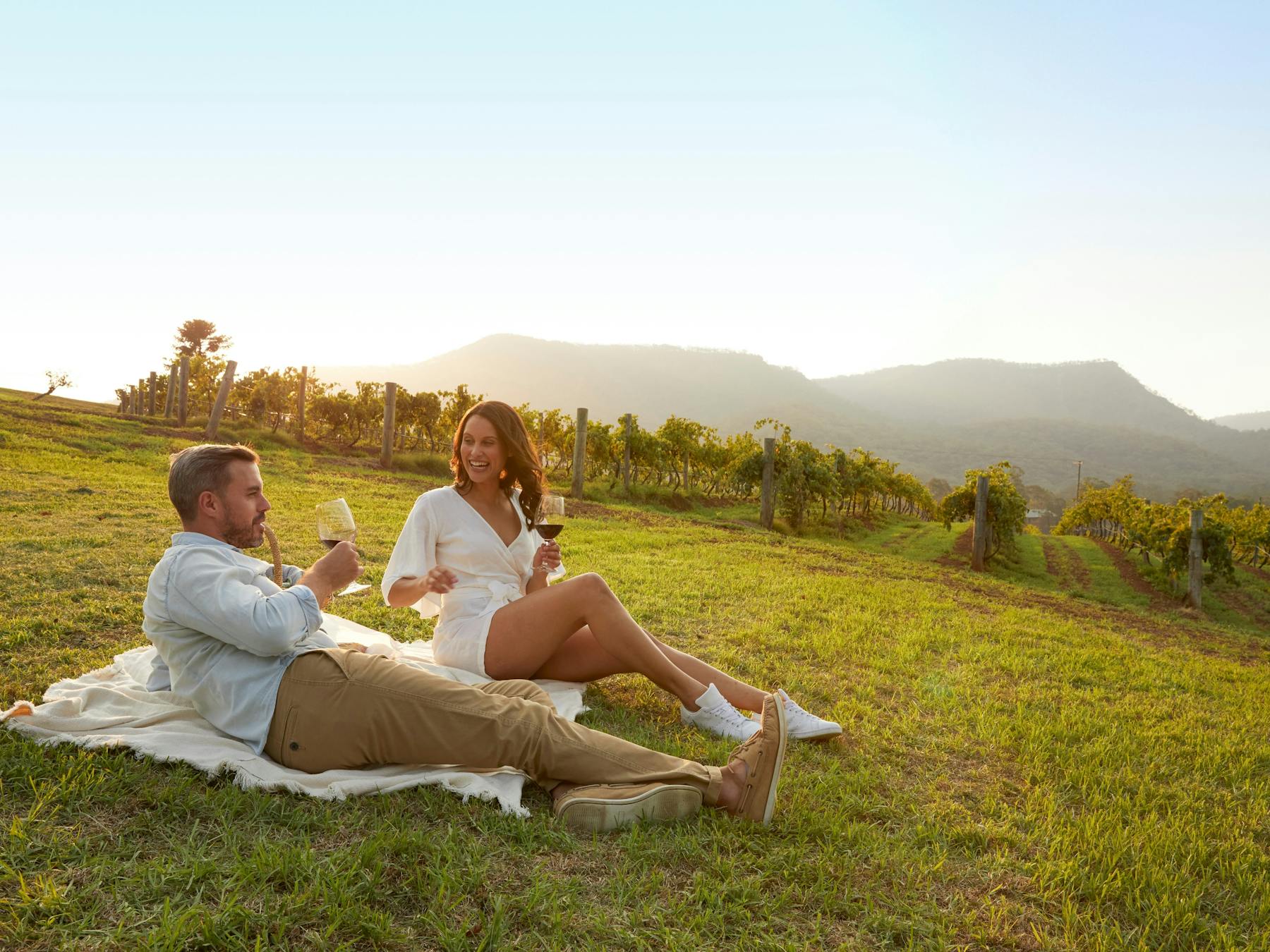 Autopia Tours - Hunter Valley - Couple enjoying a picnic, Pokolbin
