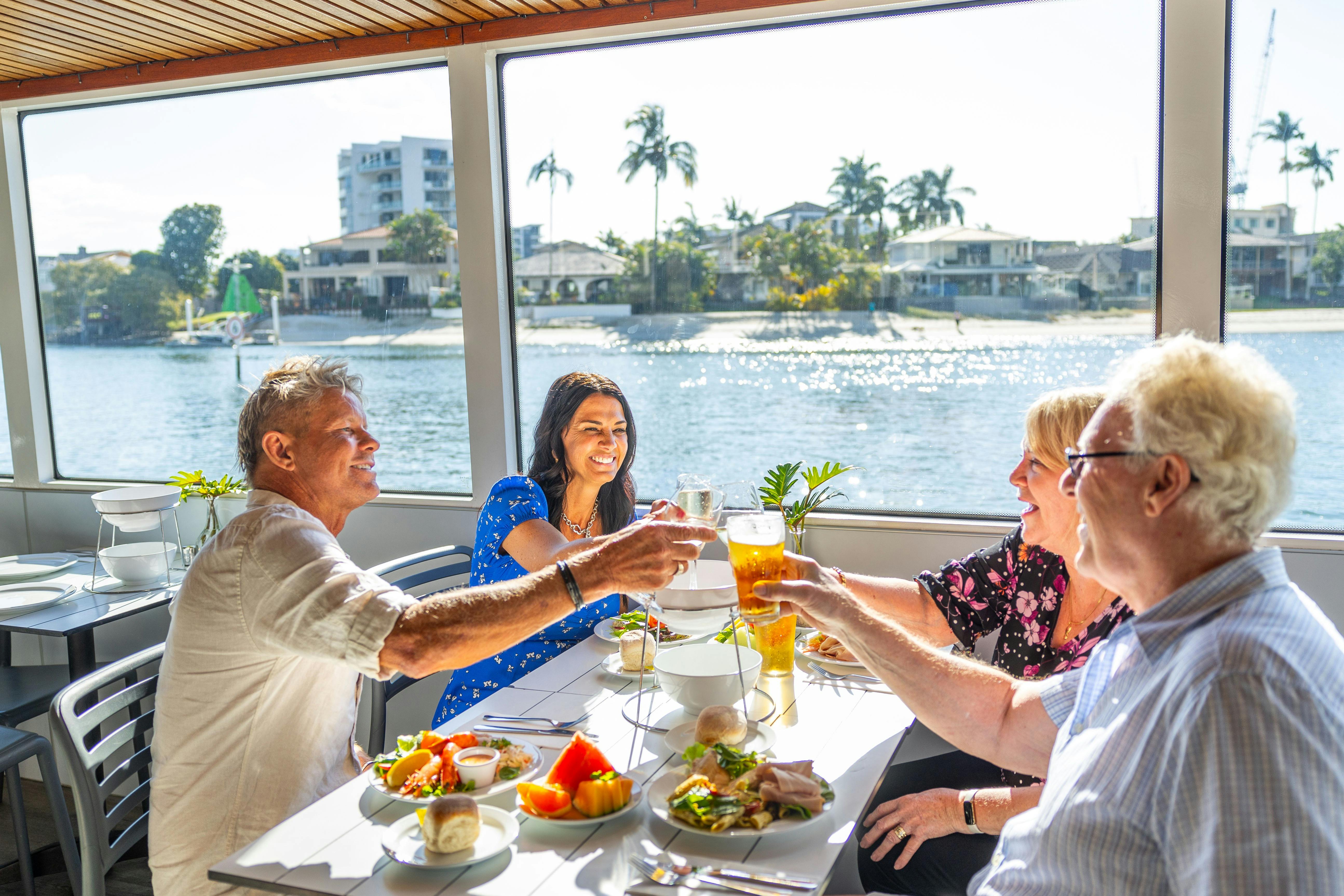 Group of friends cheersing inside a boat