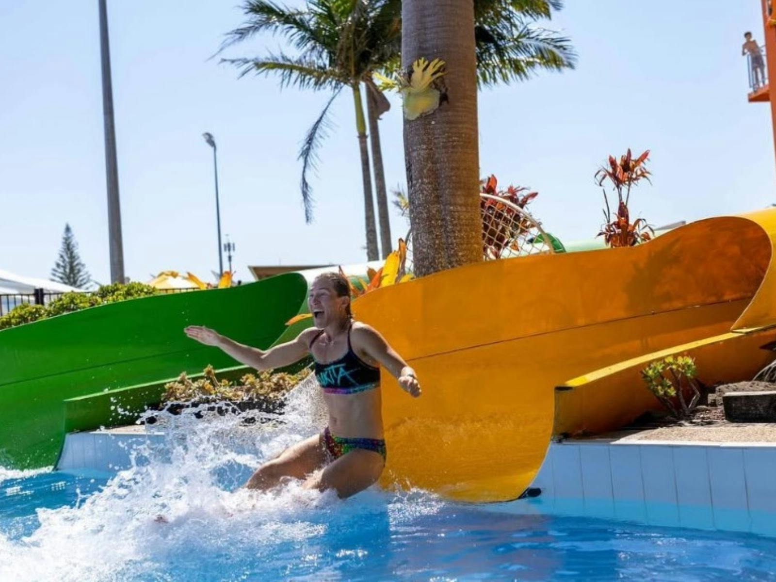 girl sliding down a slide