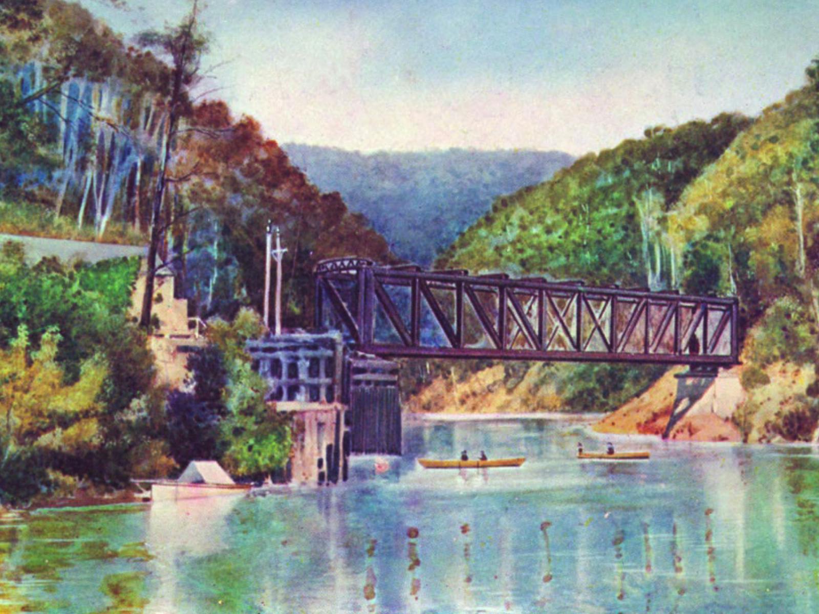 An original early 20th century postcard from Teepookana depicting the Iron Bridge and kayakers
