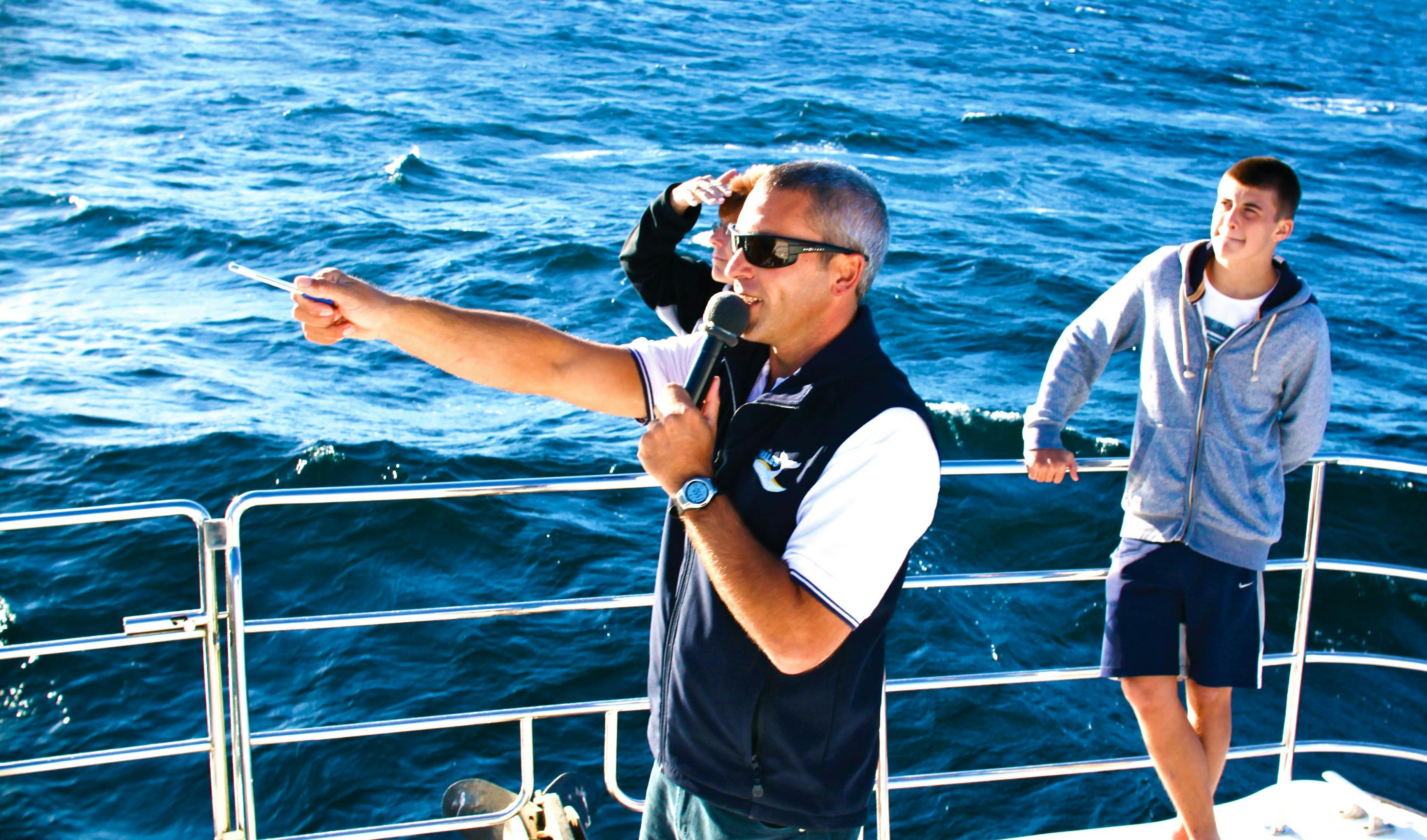 Boat captain with microphone on boat
