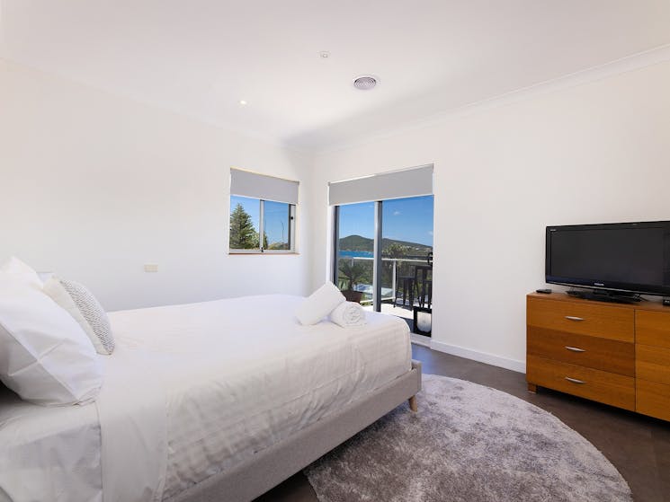 Bedroom with Queen bed, TV and ocean views