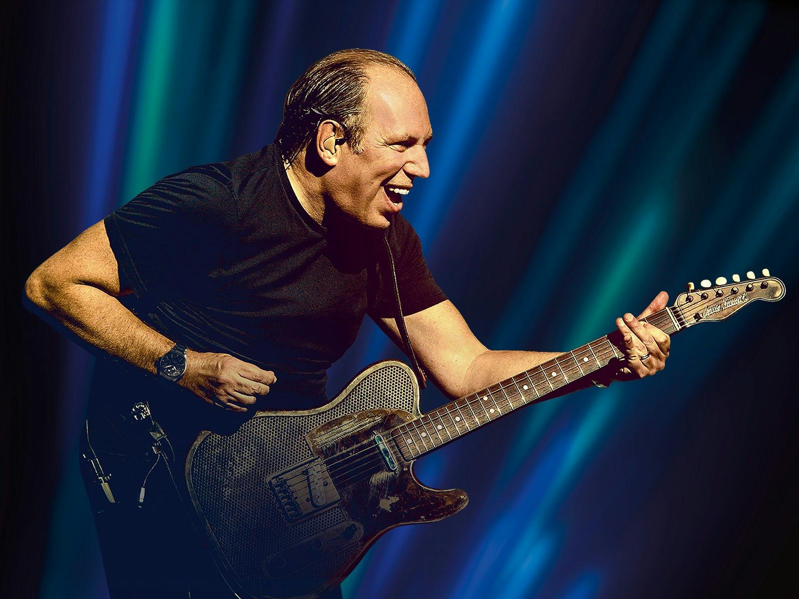 Closeup Hans Zimmer playing guitar