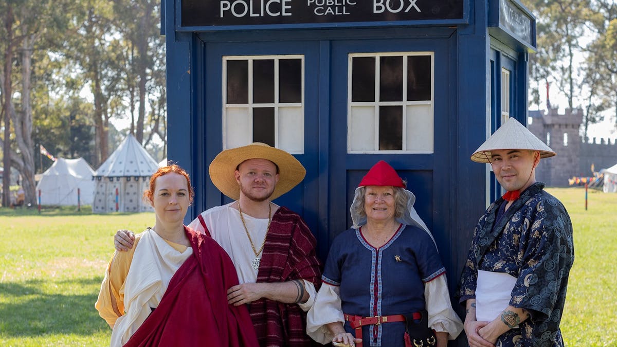 four guests dressed in Roman, medieval and asian culture clothing