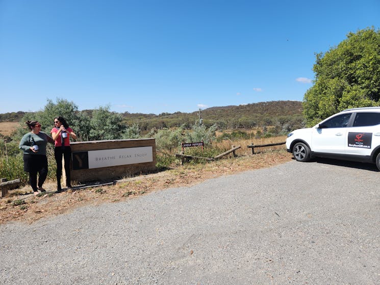 Photo of a Canberra winery tour EV parked with 2 persons