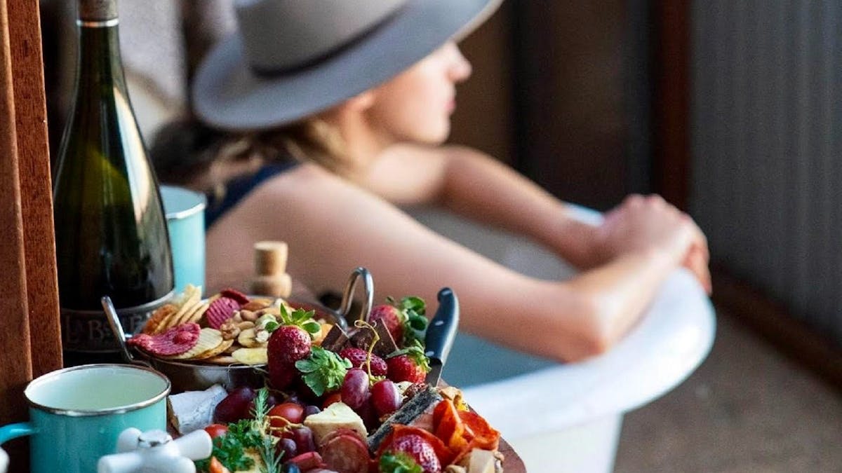 food platter and person in background at Julia Creek Artesian Baths